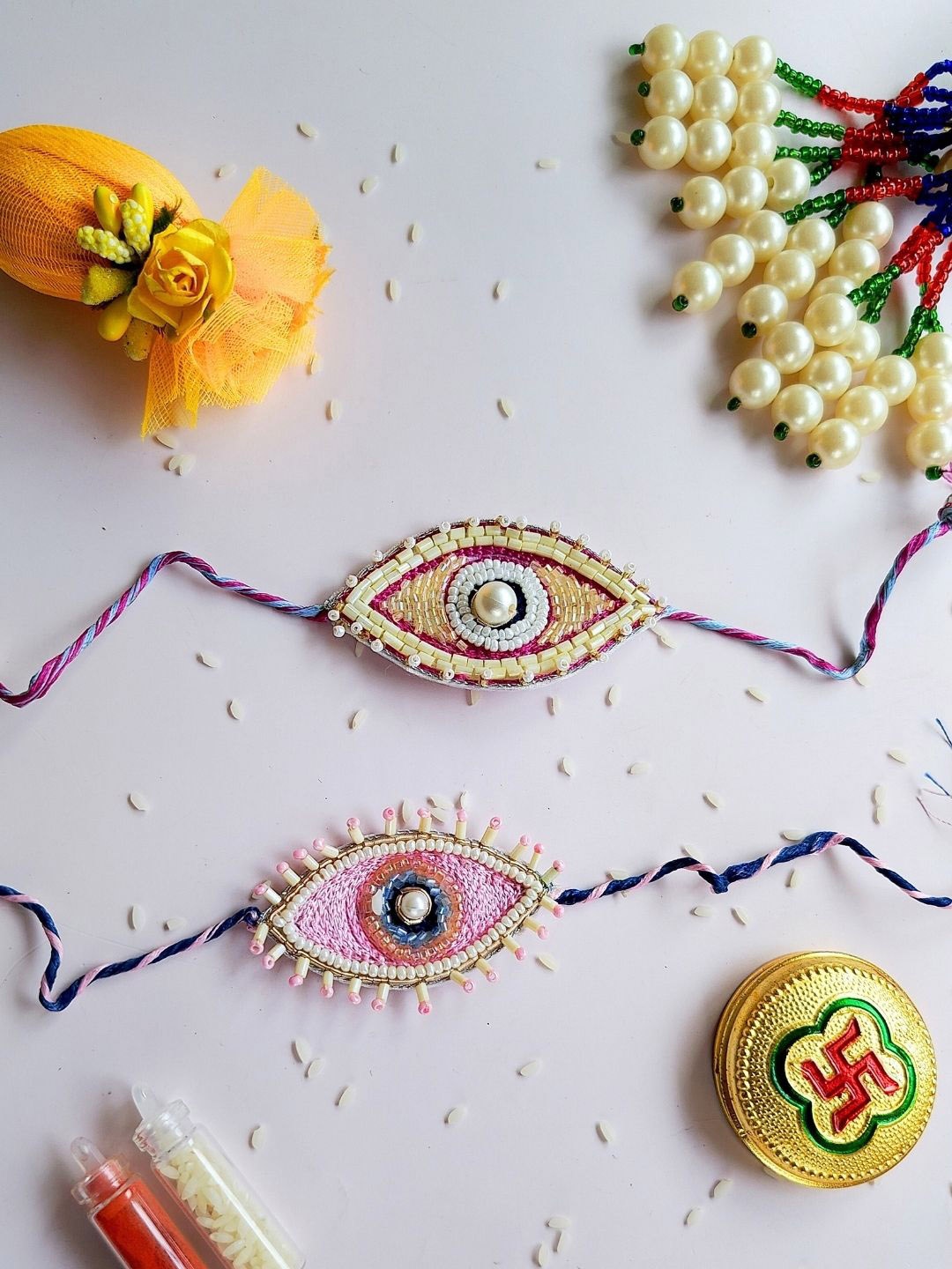

Sangria Pink & Yellow Set Of 2 Beaded Evil Eye Thread Rakhis