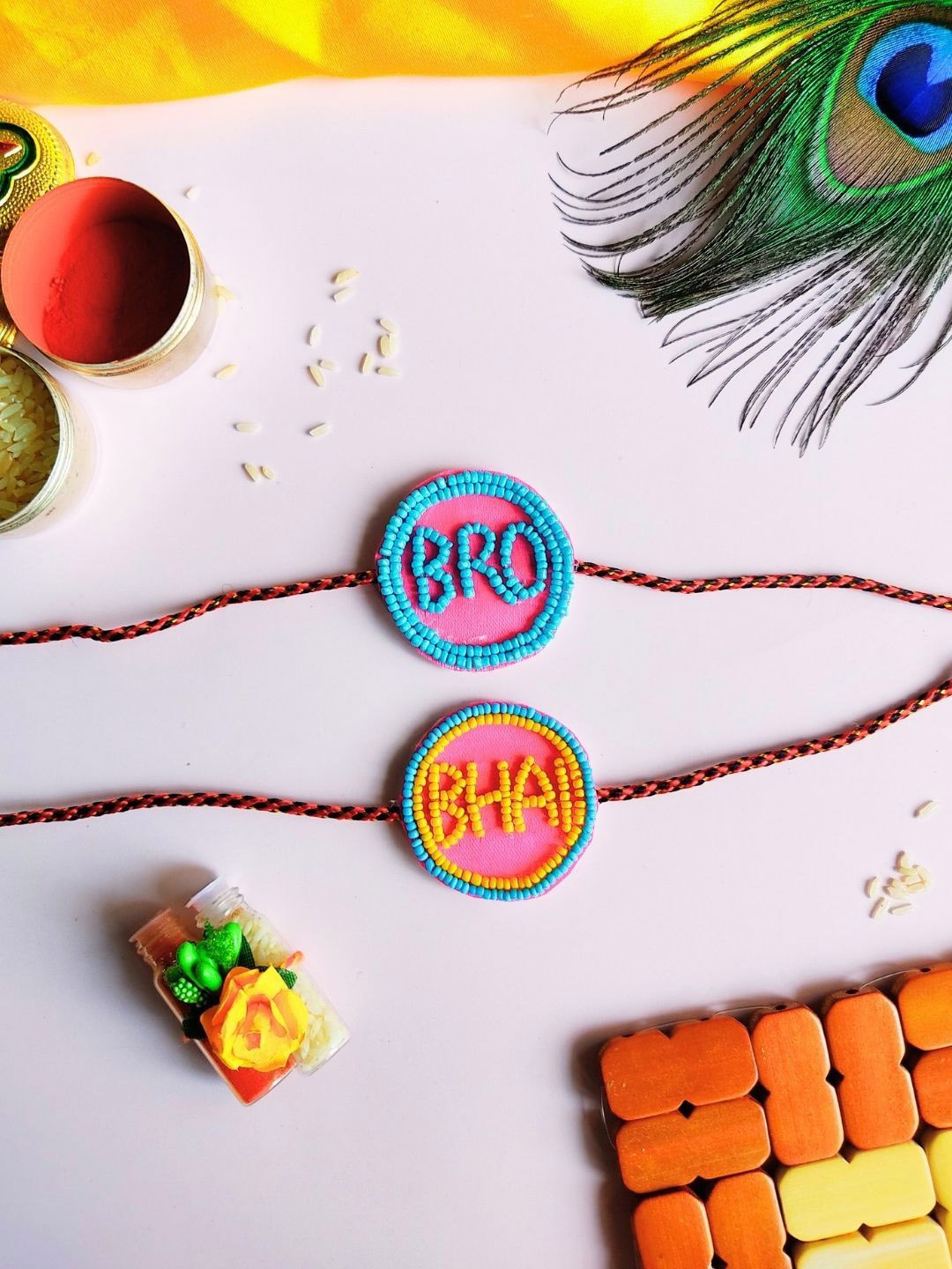 

Sangria Red & Yellow Set Of 2 Beaded Bro & Bhai Rakhis