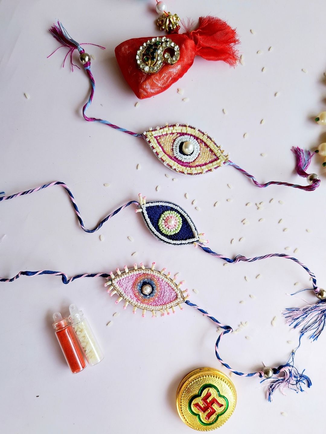 

Sangria Pink & Blue Set Of 3 Stone-Studded Evil Eye Rakhis
