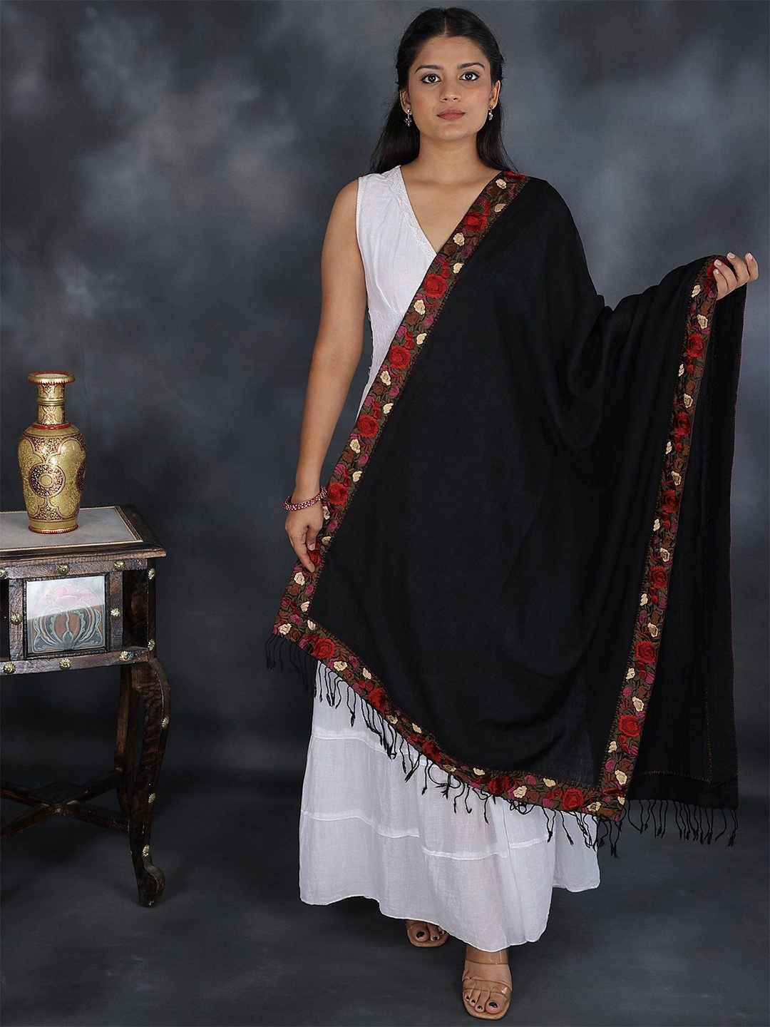 

Exotic India Pirate Black Pure Wool Stole with Embroidered Floral Patch Border