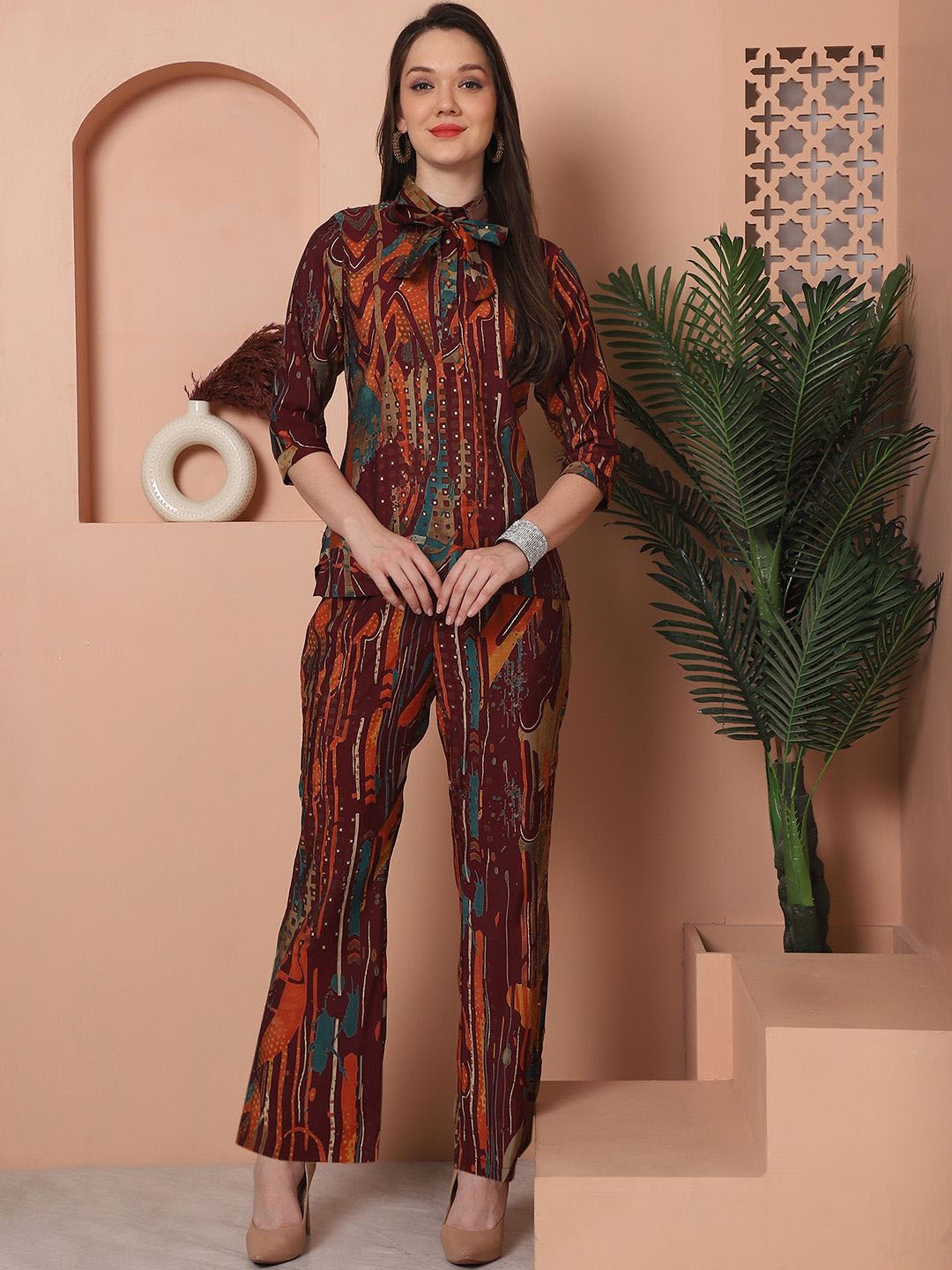 

Claura Burgundy Abstract Printed Shirt Collar Neck Top & Flared Trouser