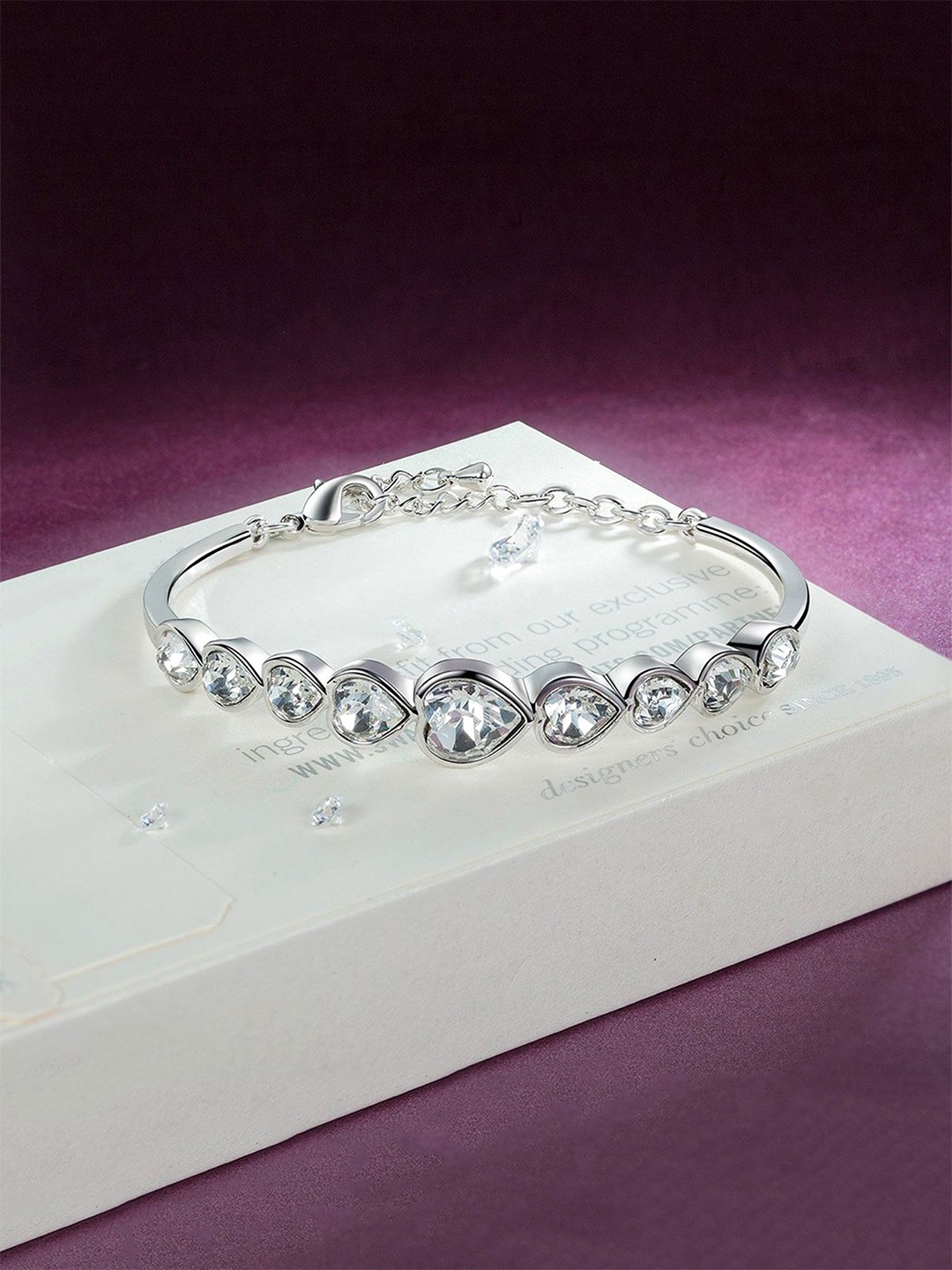 

Yellow Chimes Silver-Plated Crystals Studded Bangle-Style Bracelet