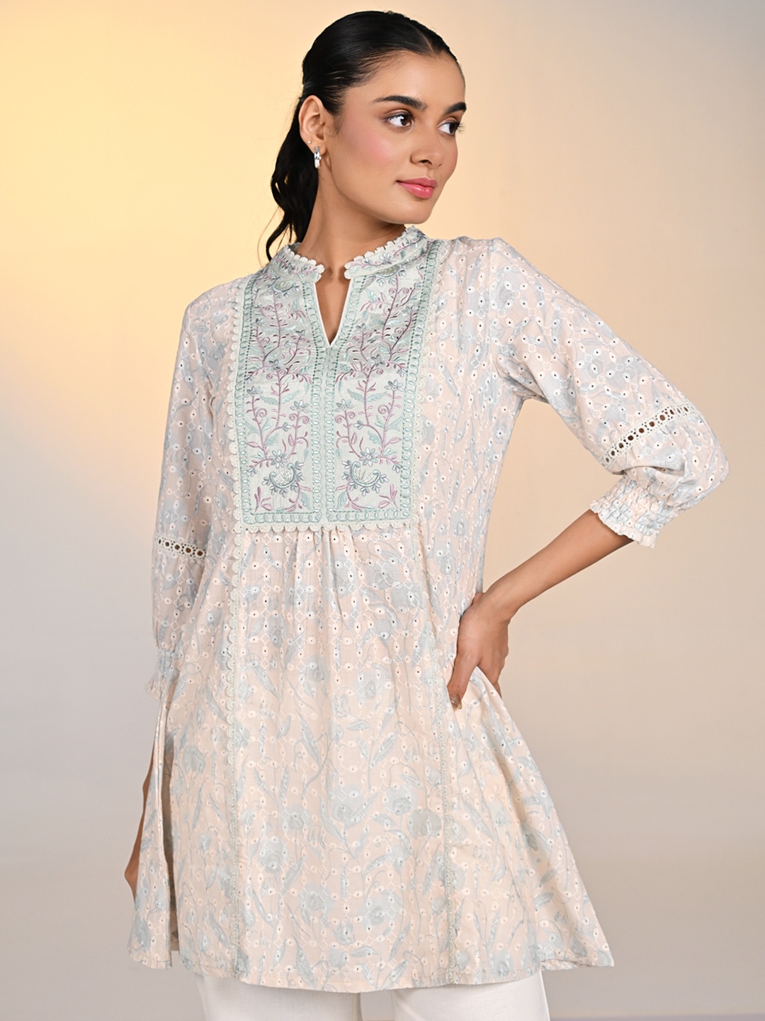 

Lakshita Ethnic Motifs Embroidered Schiffli Thread Work Mandarin Collar Kurti, Cream