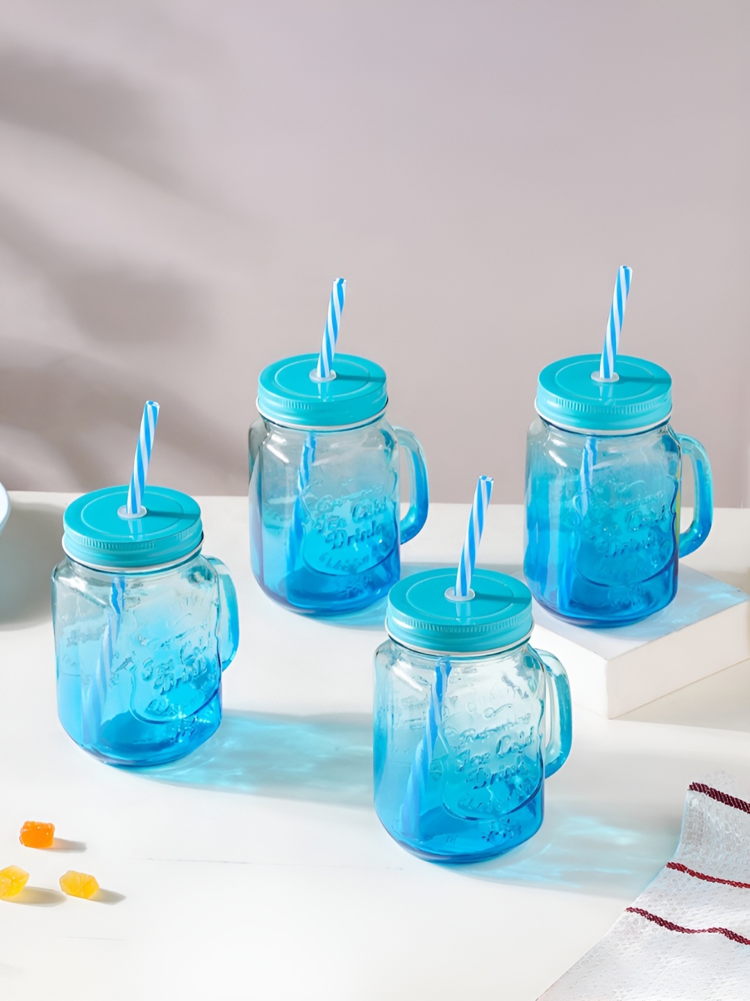 

Nestasia Transparent & Blue 4 Pieces Glass Transparent Mugs With Lid 400 ml