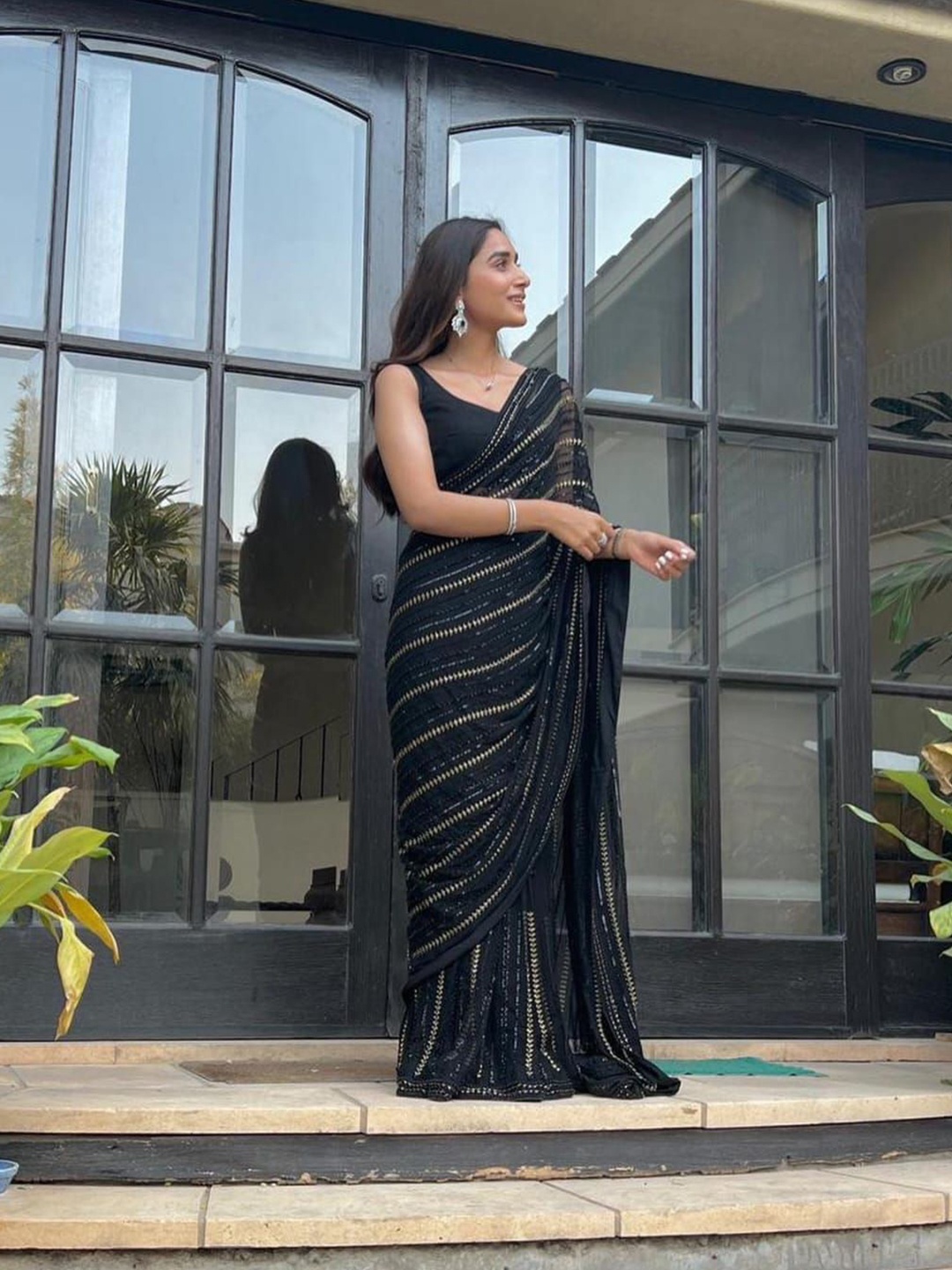 

Celeb Styles Striped Embroidered Pure Georgette Saree, Black