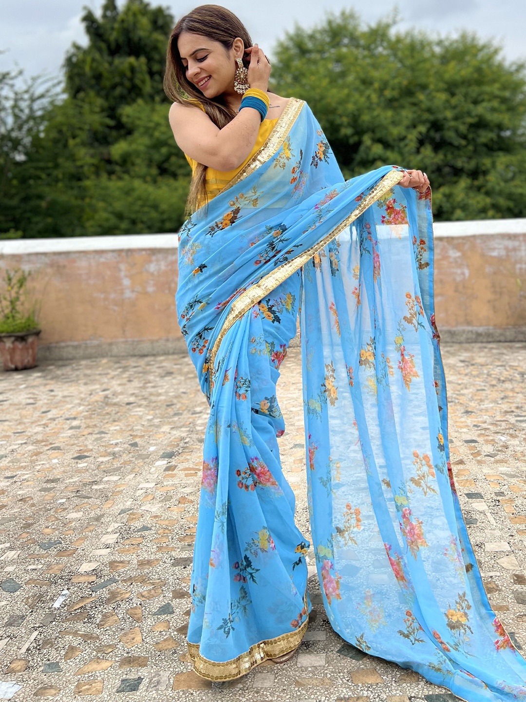 

Celeb Styles Floral Sequinned Pure Georgette Saree, Blue