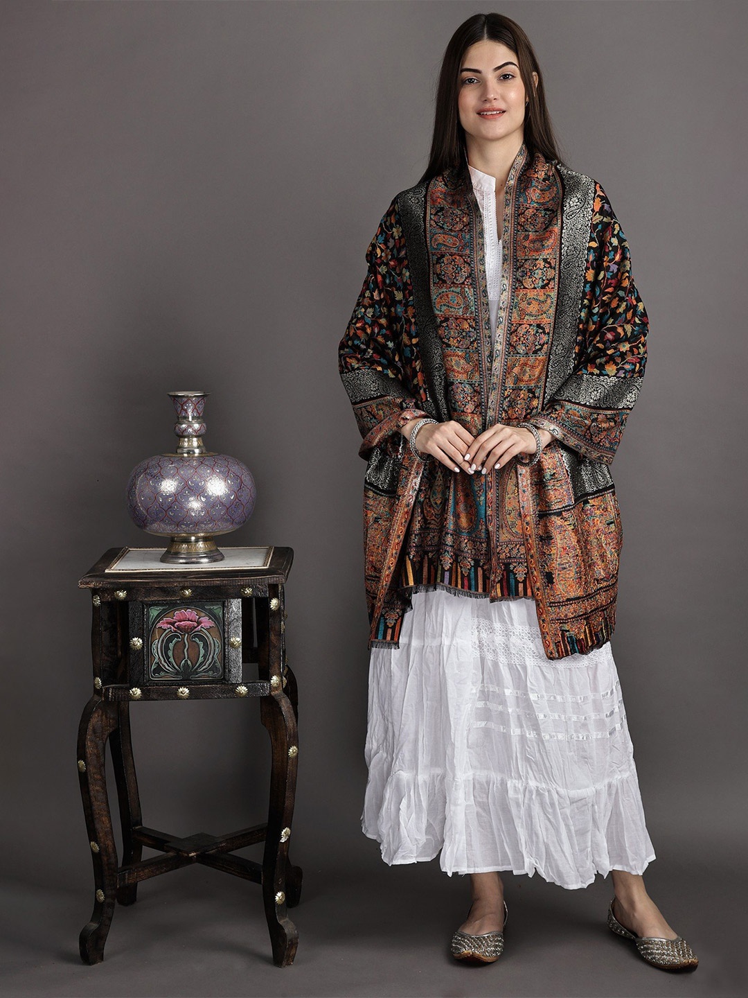 

Exotic India Black Beauty Woven Flowers Kani Jamawar Stole with Golden Border