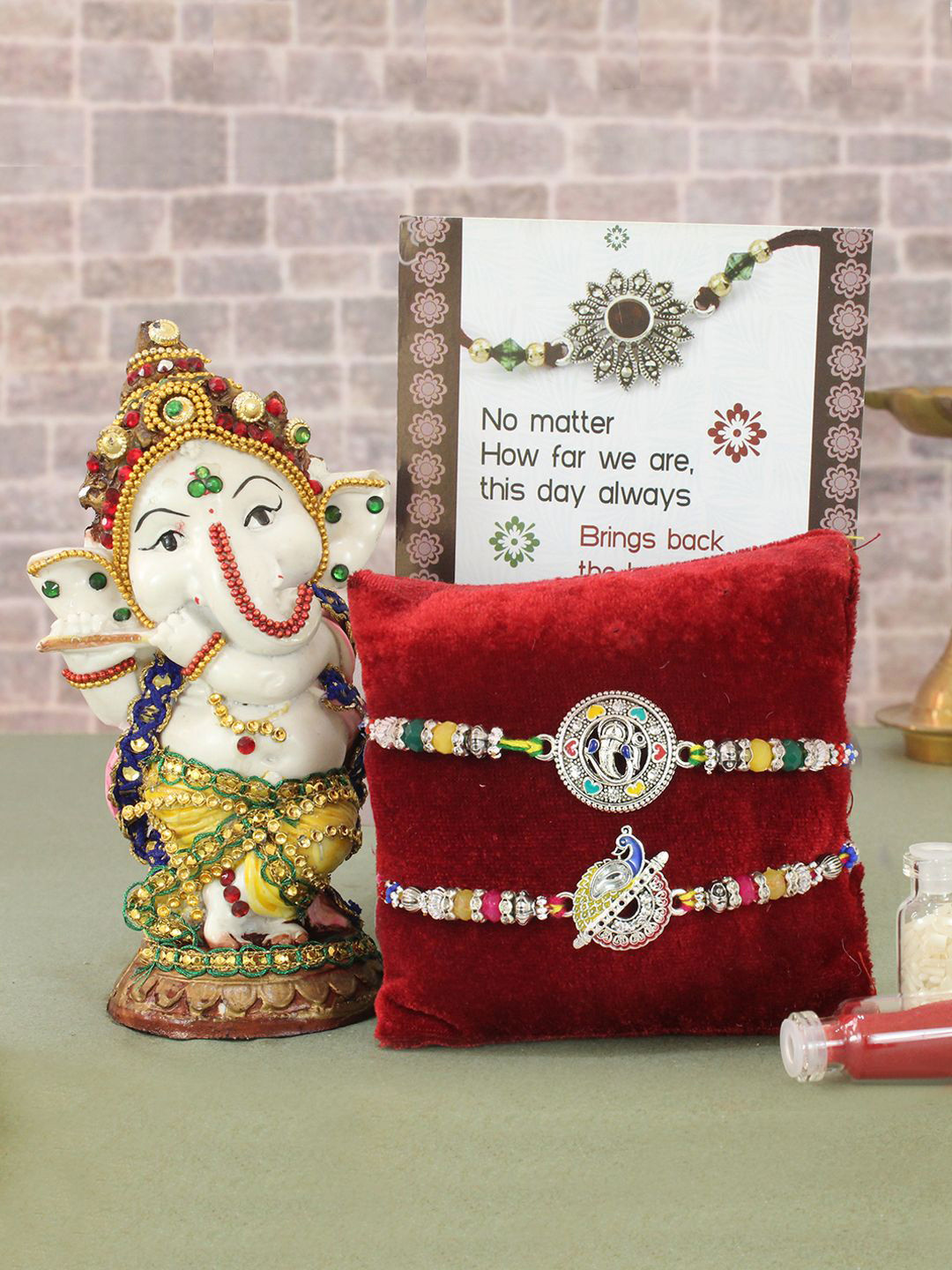 

TIED RIBBONS Set of 2 Premium Rakhi With Ganesh Idol Greeting Crad & Tikka Combo Set, White