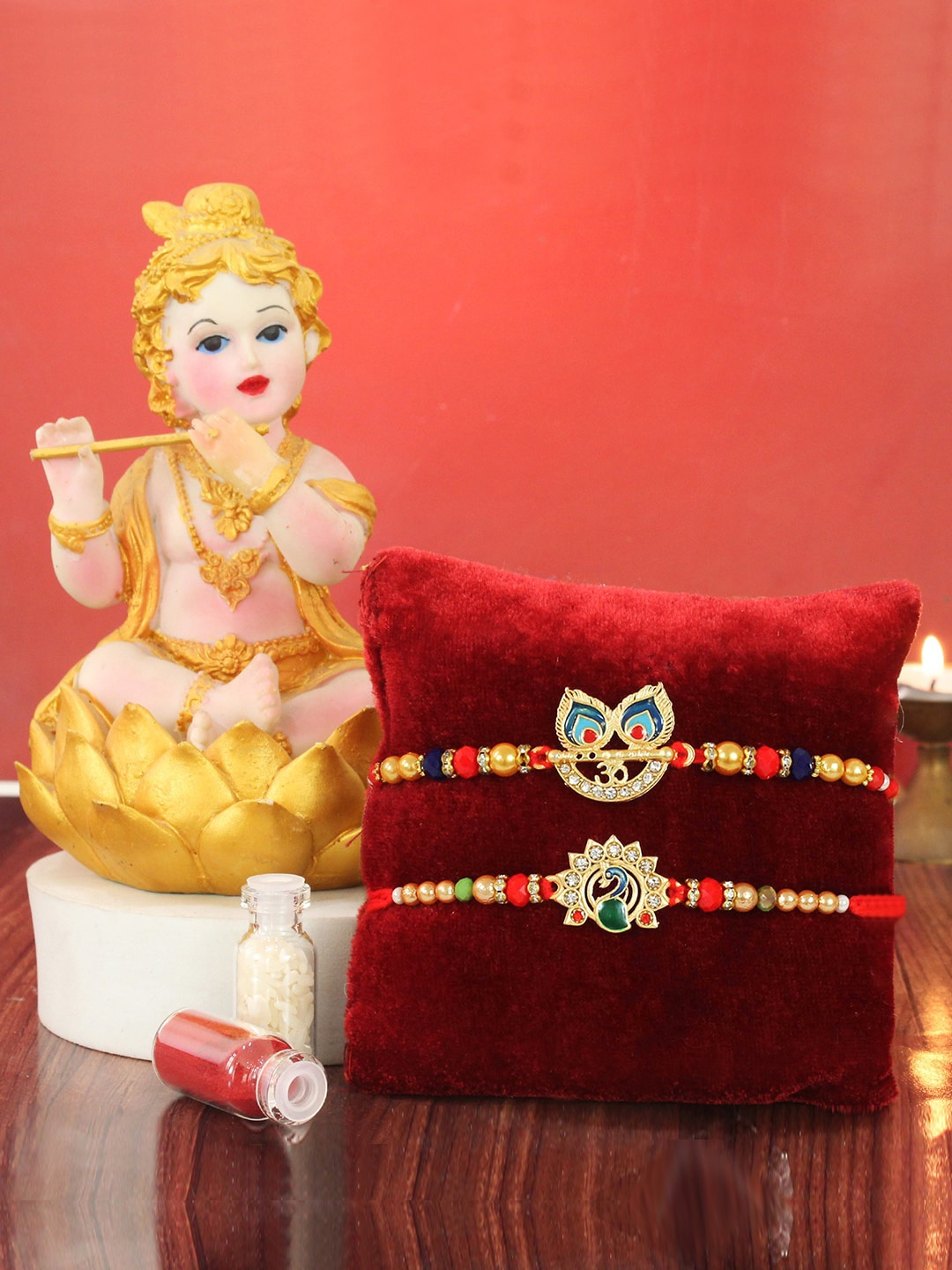 

TIED RIBBONS Set Of 2 Peacock Rakhi With Krishna Idol Card & Roli Chawal Rakhi Gift Set, Gold