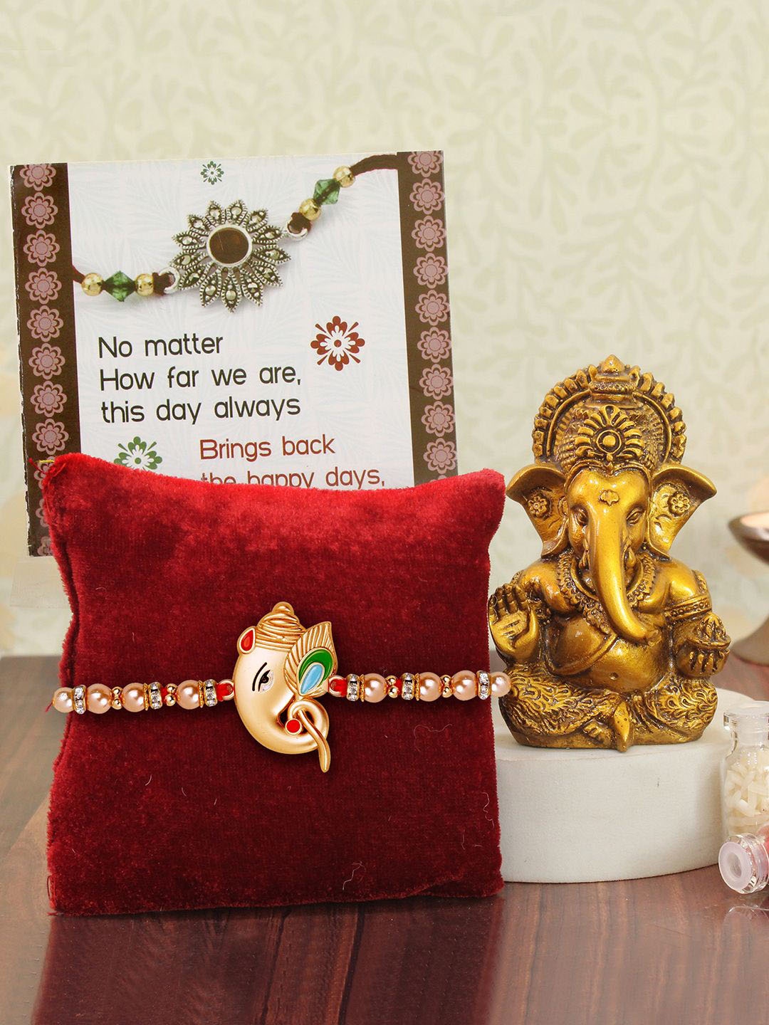

TIED RIBBONS Ganesha Details Thread Rakhi With Mini Ganesha Idol Card & Roli Chawal Gift, Copper