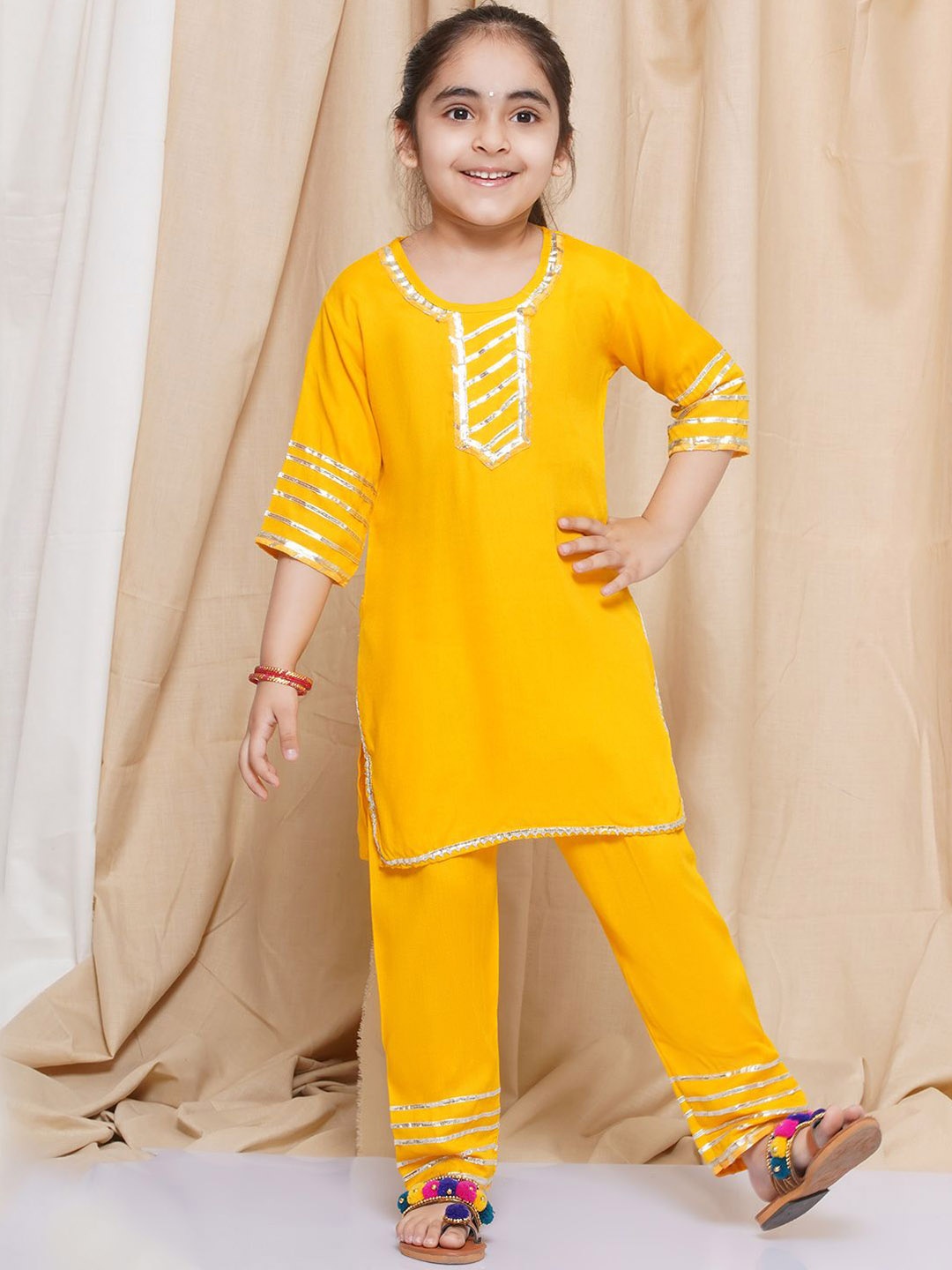 

Aj DEZInES Girls Solid Gotta Patti Pure Cotton Kurta with Pyjamas, Yellow