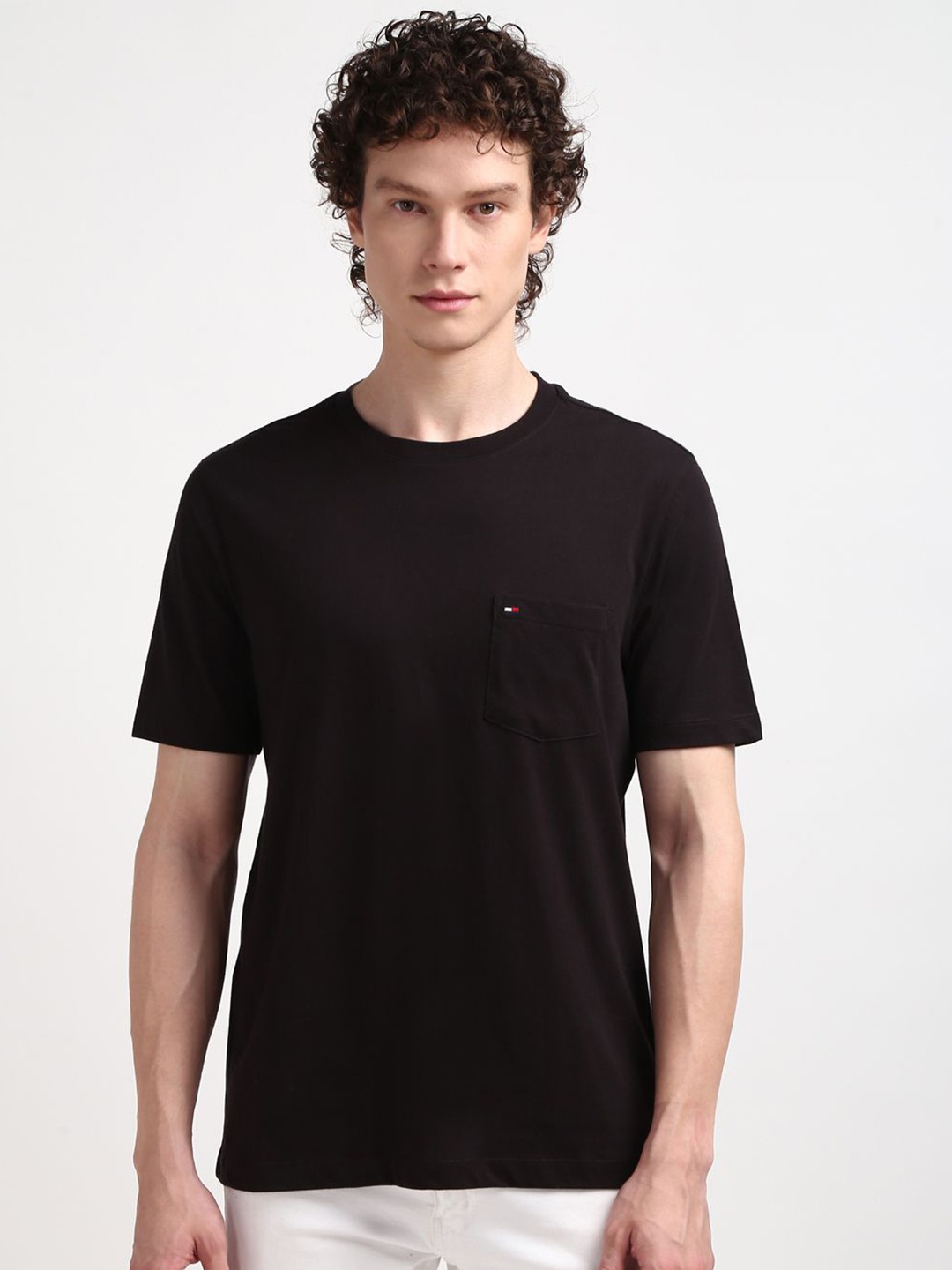 

Tommy Hilfiger Men Solid Round Neck Pockets T-shirt, Black