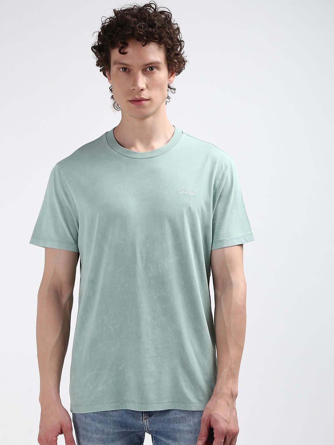 

Calvin Klein Jeans Men Round Neck Solid Pure Cotton T-shirt, Green