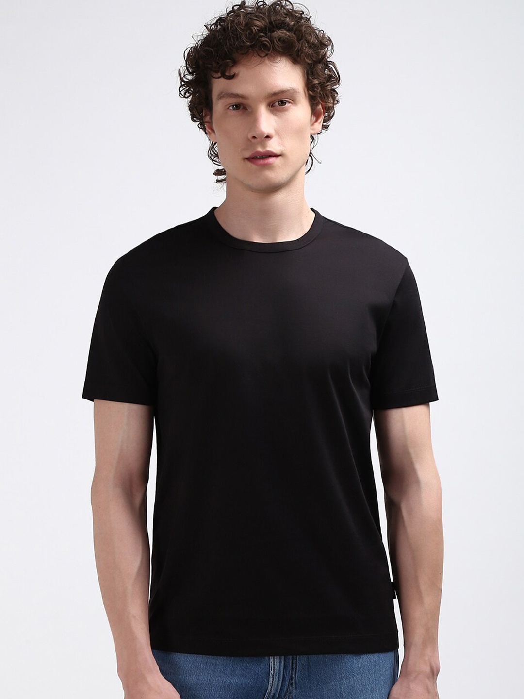 

Calvin Klein Jeans Men Round Neck Solid Cotton T-shirt, Black