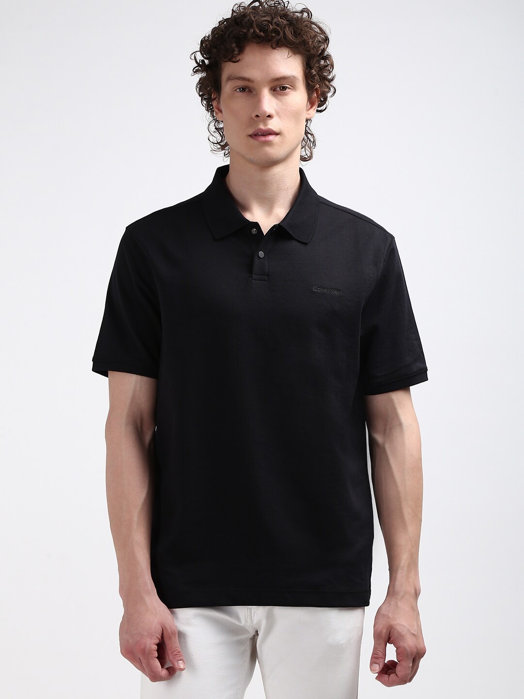 

Calvin Klein Jeans Men Polo Collar Solid T-shirt, Black
