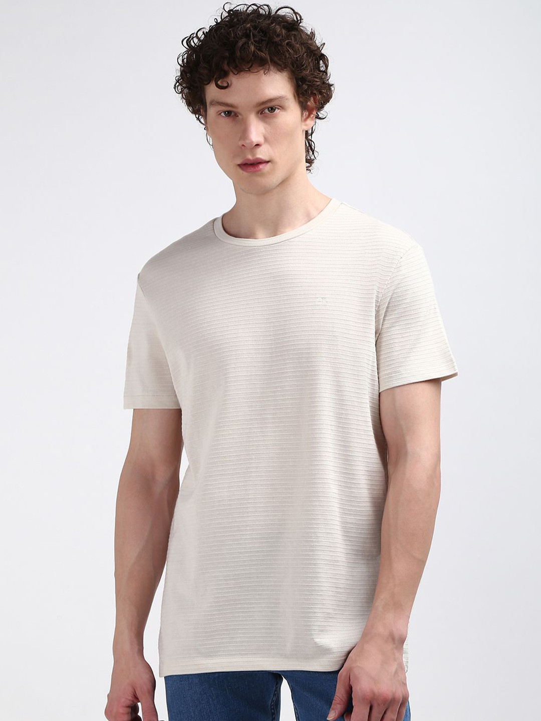 

Calvin Klein Jeans Men Round Neck Solid T-shirt, Beige