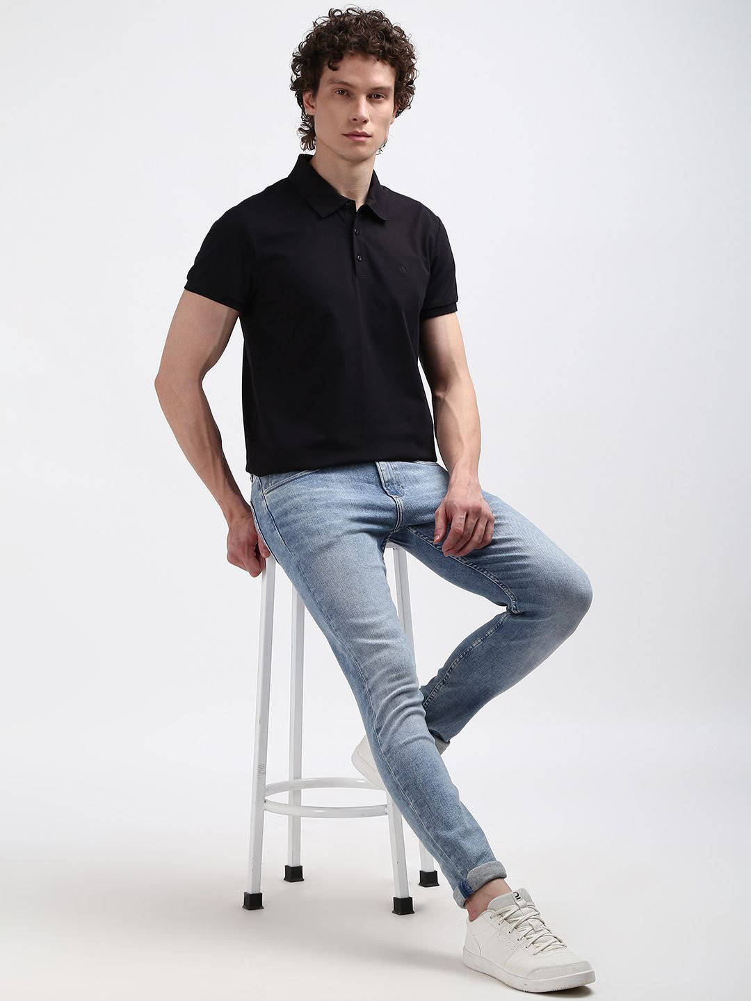 

Calvin Klein Jeans Men Polo Collar Slim Fit Solid T-shirt, Black