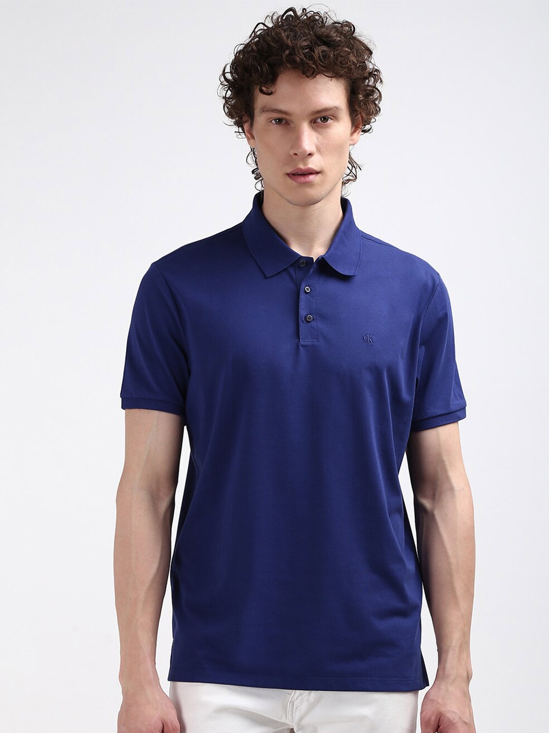 

Calvin Klein Jeans Men Polo Collar Embroidered Solid T-shirt, Blue