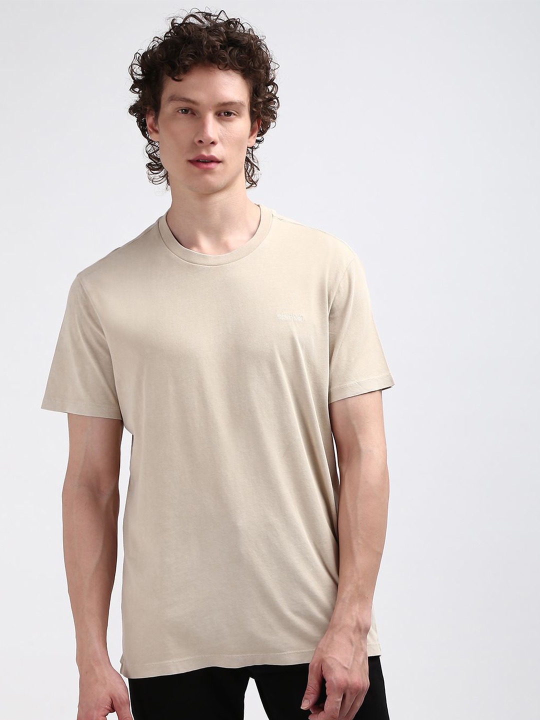 

Calvin Klein Jeans Men Round Neck Solid T-shirt, Beige