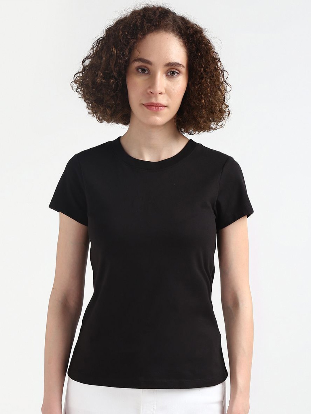 

Calvin Klein Jeans Women Round Neck Slim Fit Solid T-shirt, Black