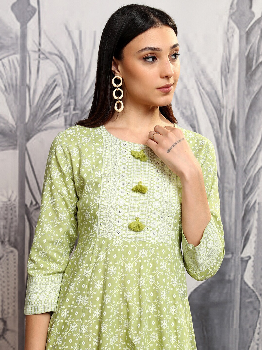 

Vishudh Green Floral Printed Sequinned & Embroidered A-Line Midi Ethnic Dress