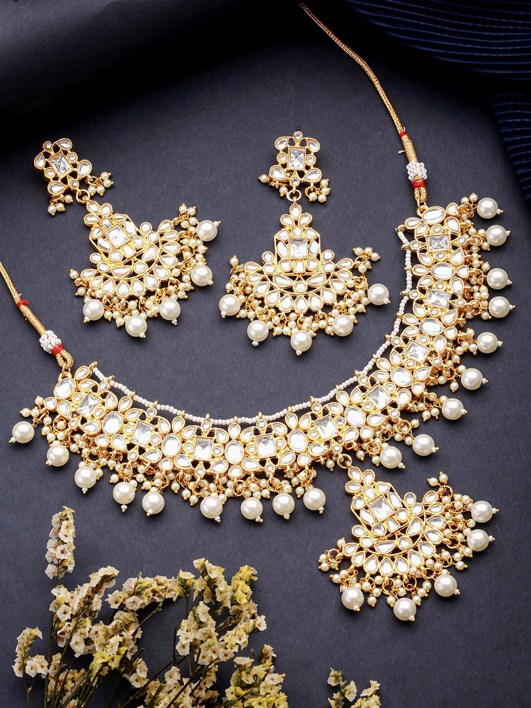 

Jazz and Sizzle Gold Plated Kundan Studded & Beaded Jewellery Set