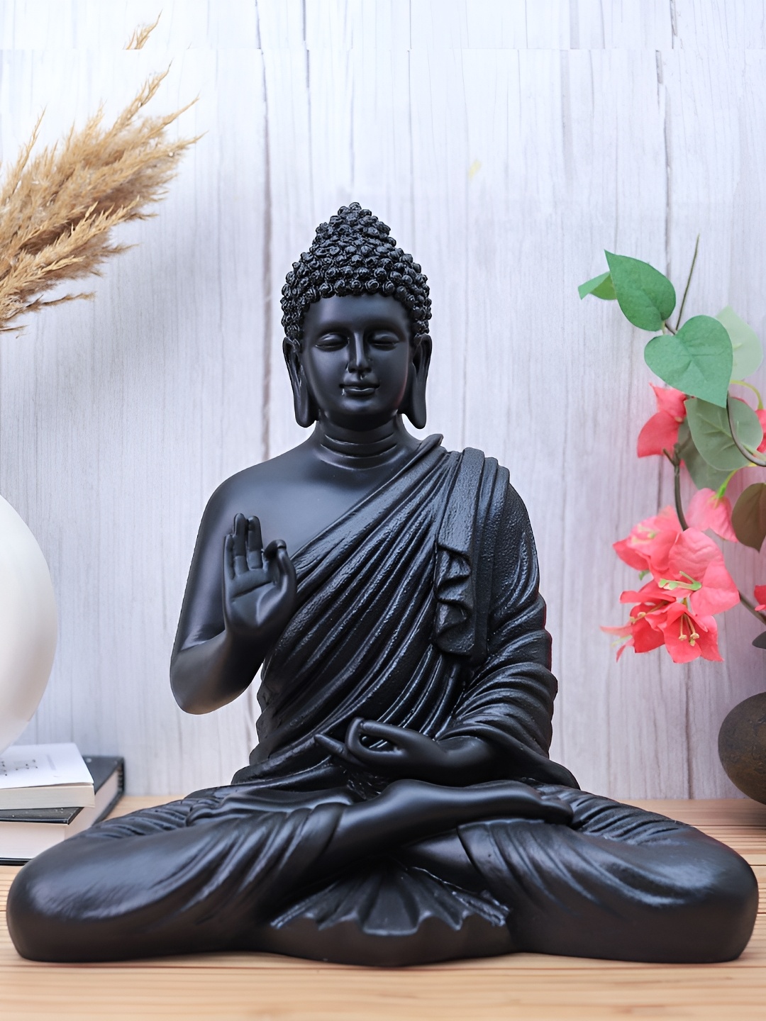 

The Advitya Black Buddha Idol Showpiece