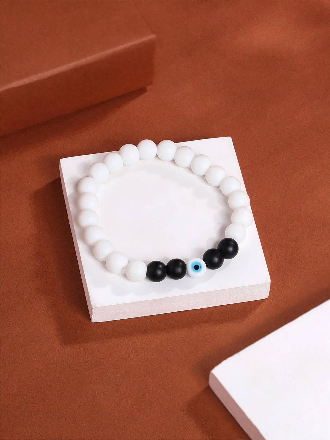 

Yellow Chimes Unisex Brass Bracelet, White
