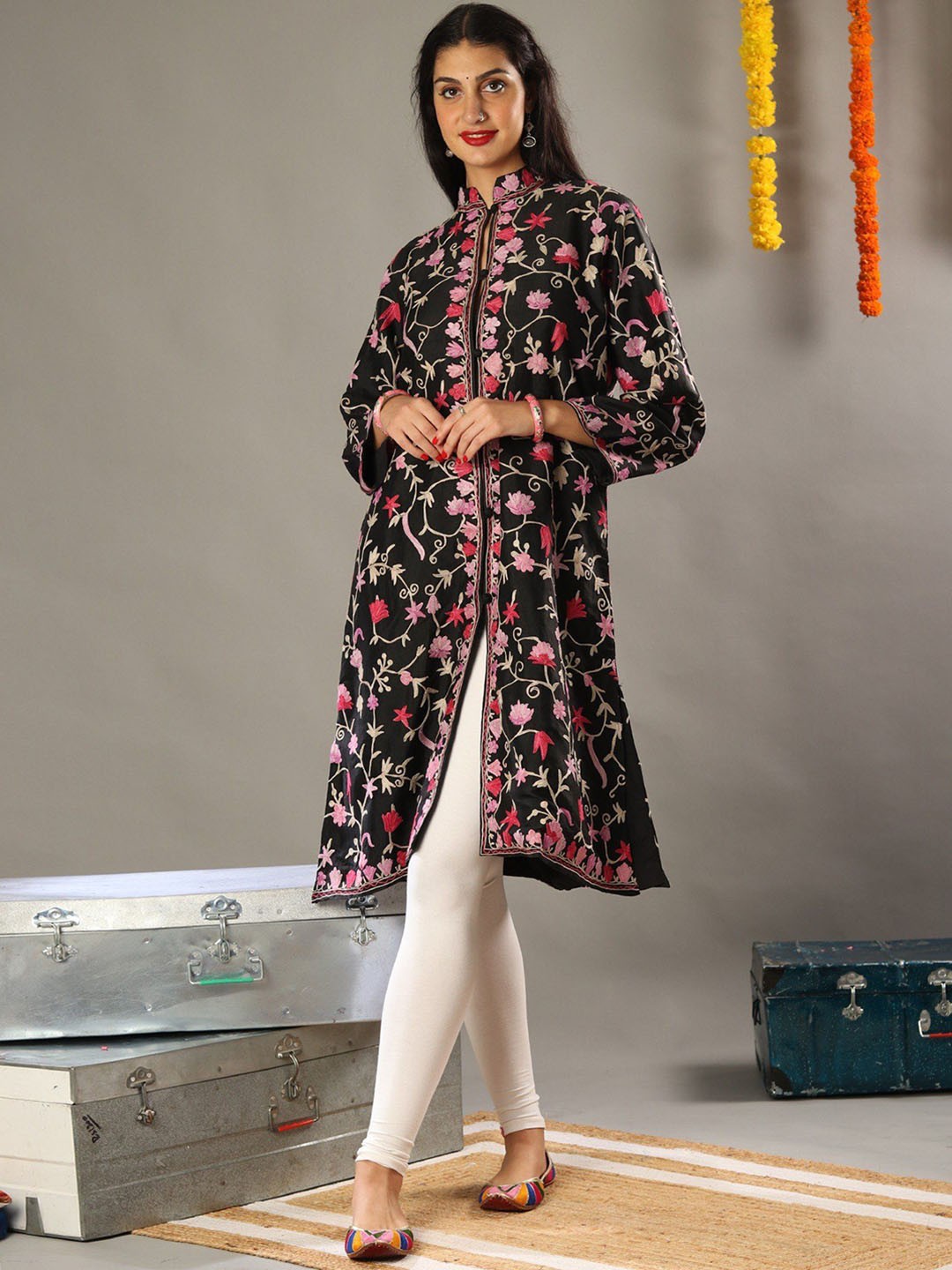 

Exotic India Aari Floral Embroidered Black Long Jacket with Traditional Kashmiri Motifs