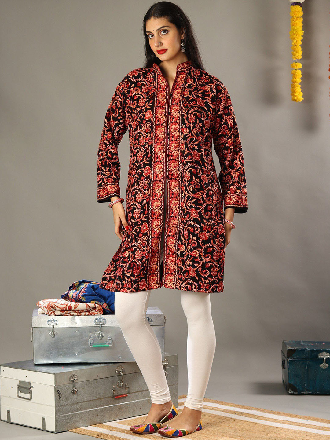 

Exotic India Aari Floral Embroidered Black Pure Wool Long Jacket with Kashmiri Motifs