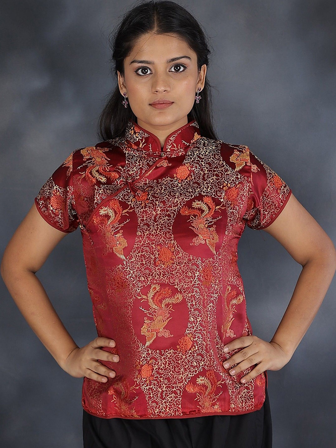

Exotic India Women Cheongsam Silk Jacket with Brocade Weave, Maroon