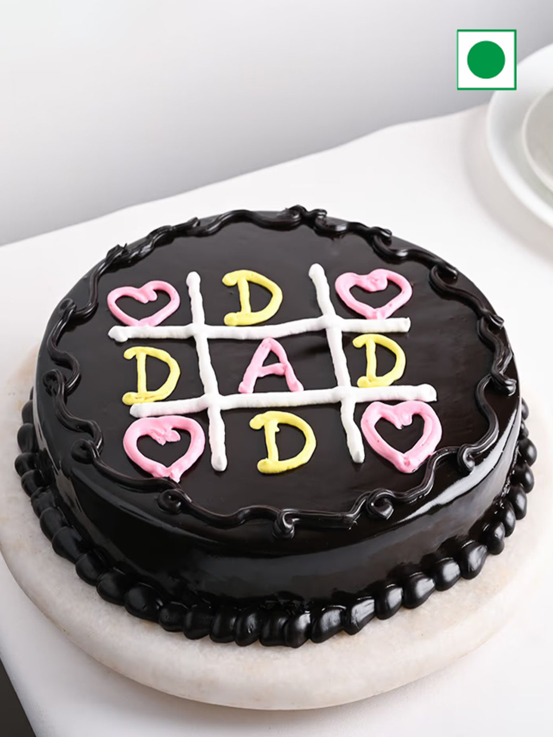 

Floweraura Tic Tac Chocolate Flavor Eggless Round Cake- 1 Kg, Black