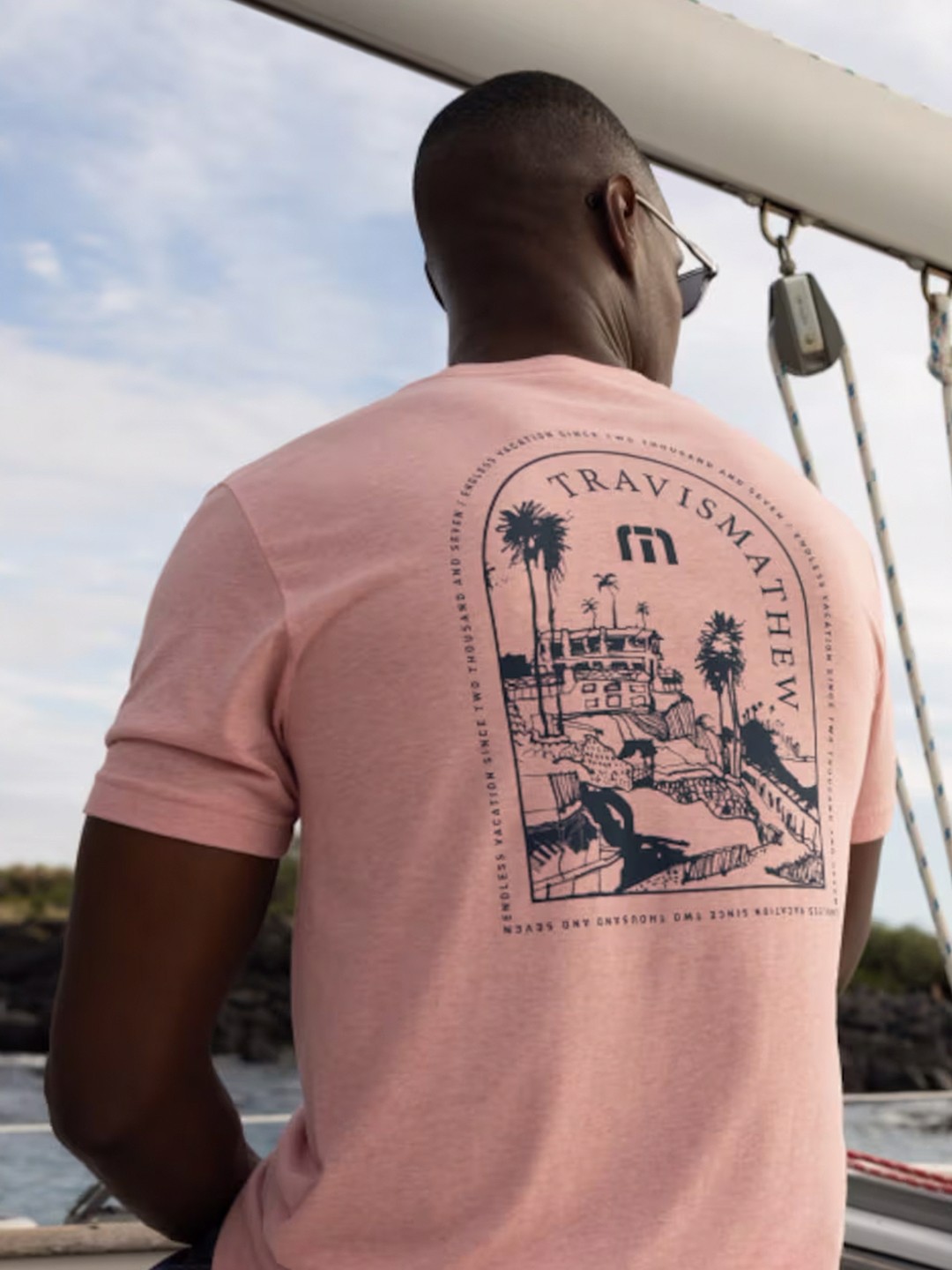

TRAVIS MATHEW Men Graphic Printed Round Neck T-Shirt, Peach