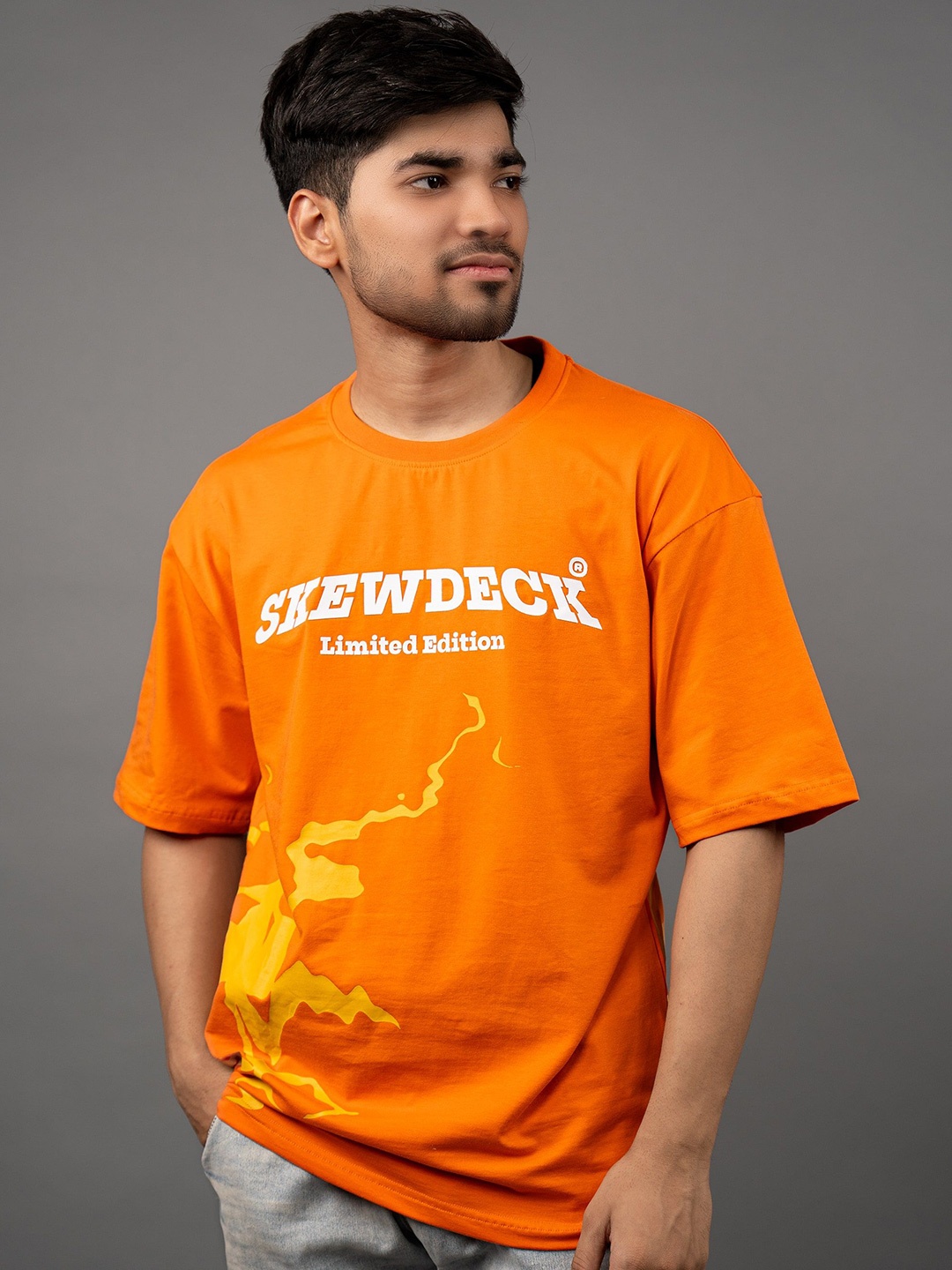 

Skewdeck Men Typography Printed Round Neck Oversized T-shirt, Orange