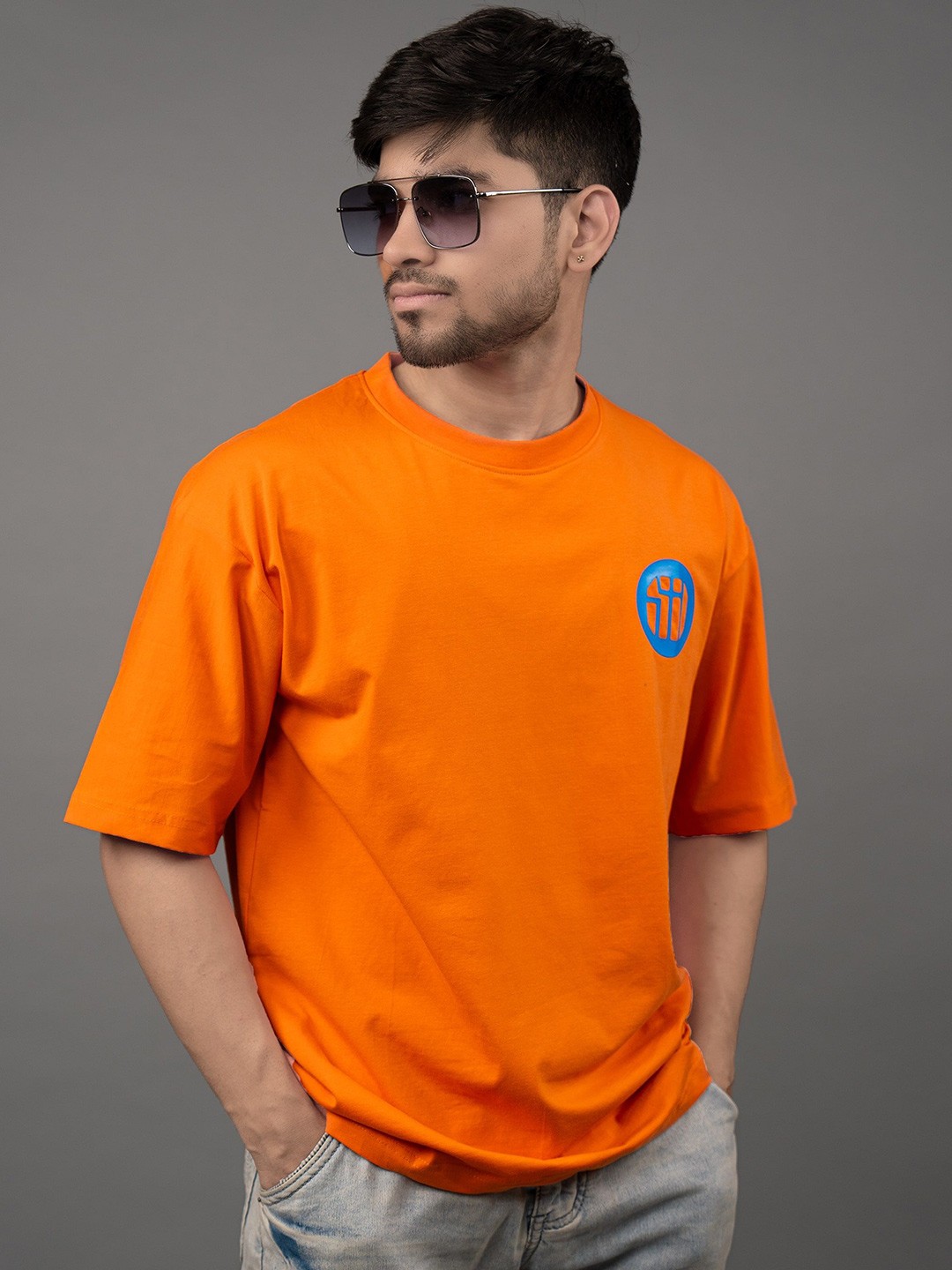 

Skewdeck Men Graphic Printed Round Neck Oversized T-shirt, Orange