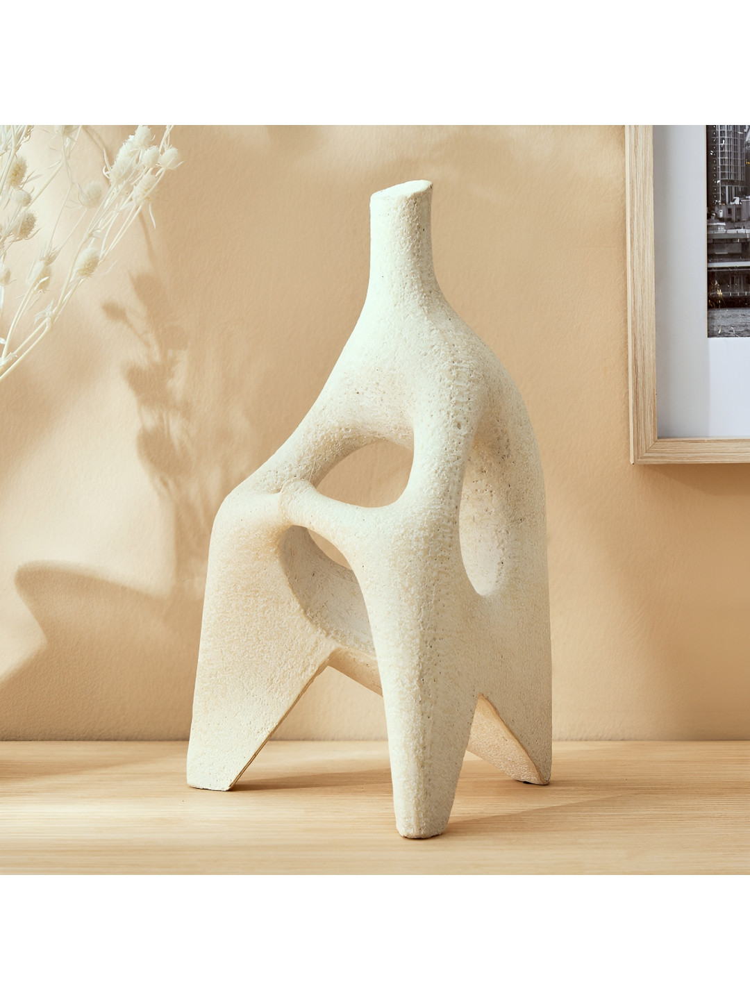 

Home Centre Off White Figurine Showpiece