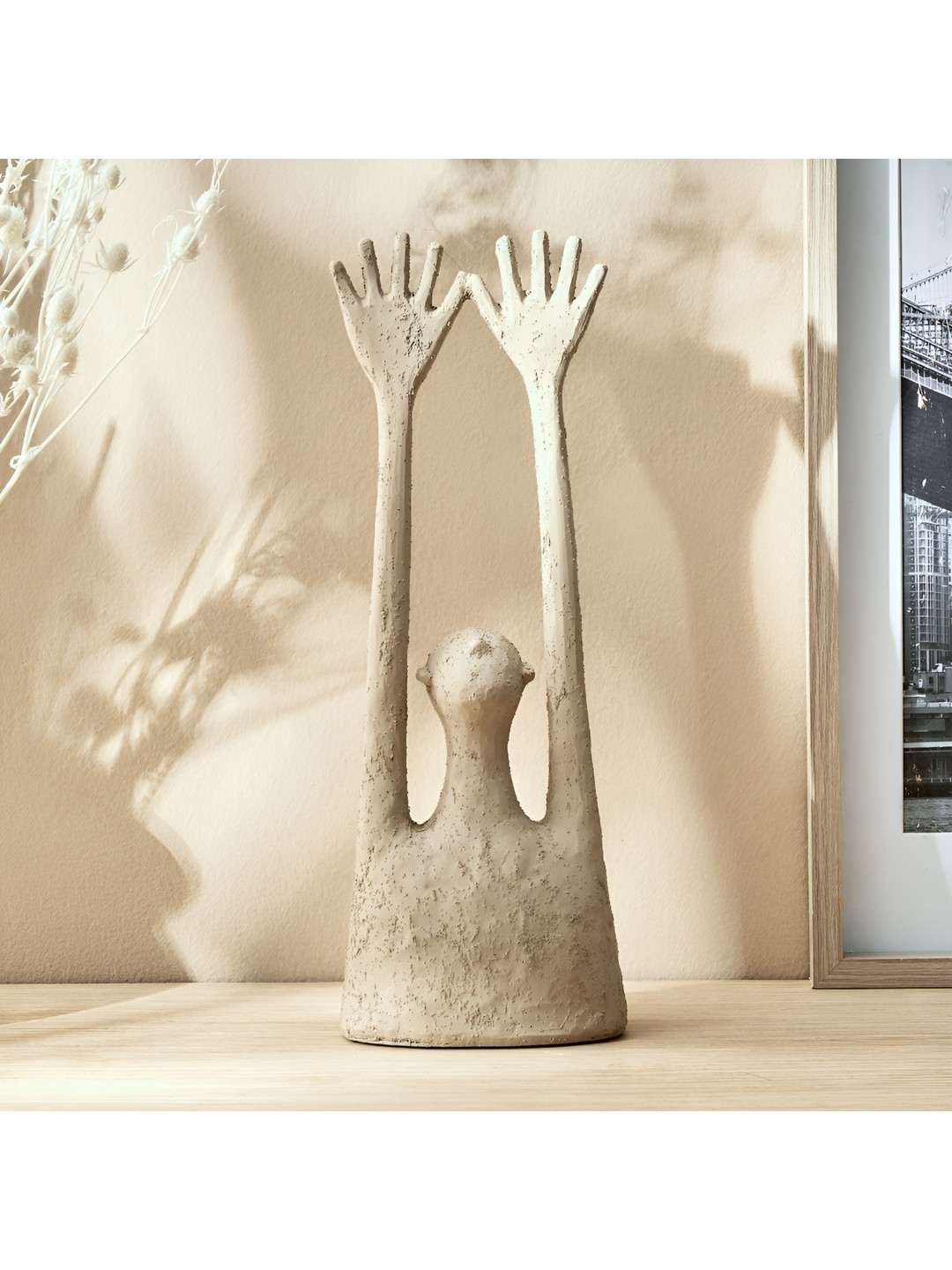 

Home Centre Off White Figurine Showpiece