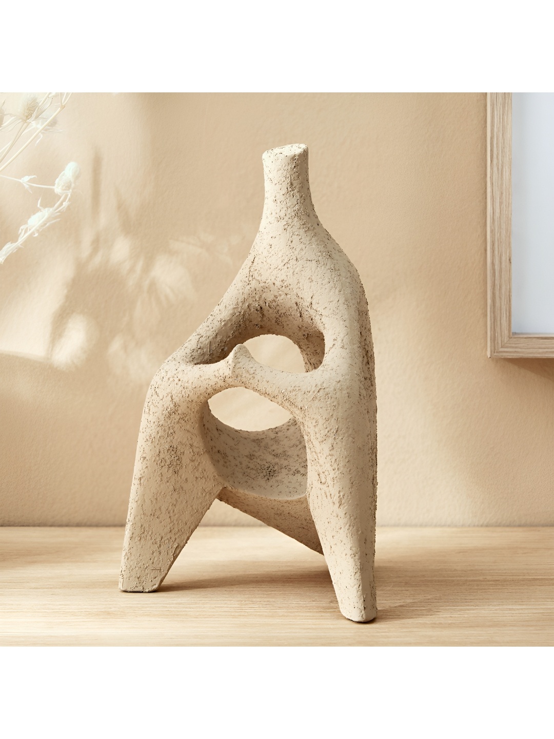 

Home Centre Off White Figurine Showpiece