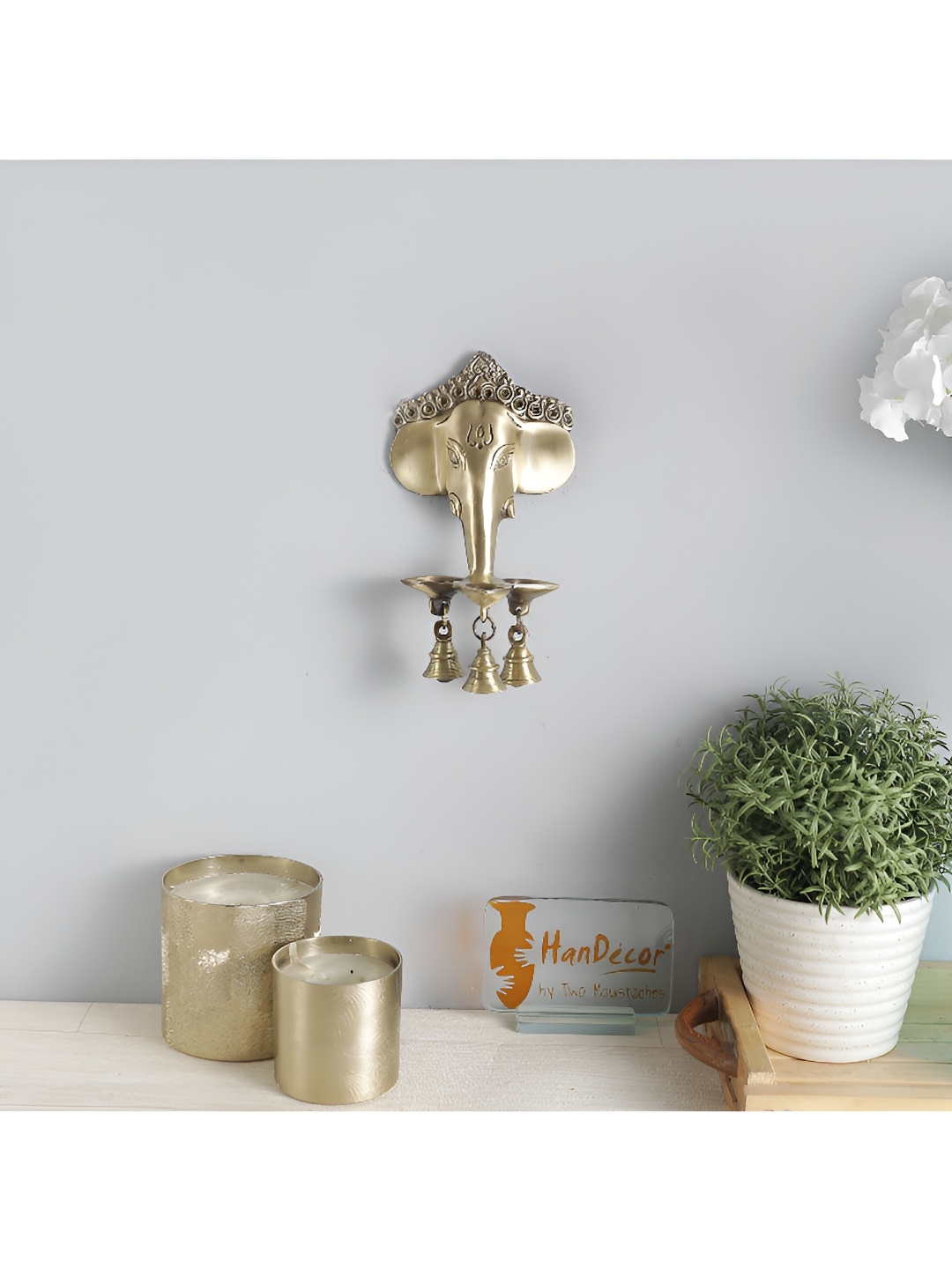 

Two Moustaches Brass Ganesha Diya with Bells Wall Hanging, Gold
