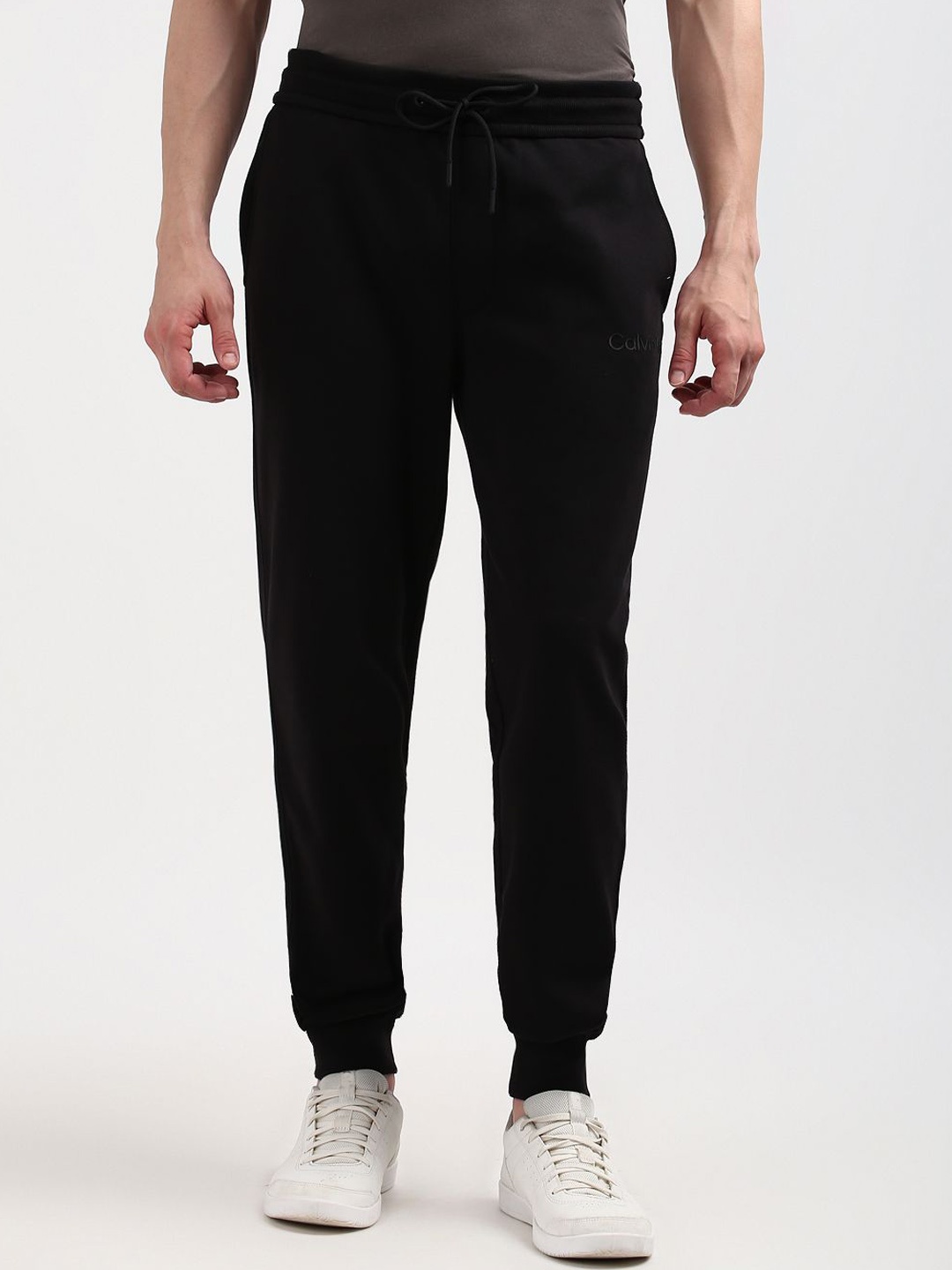 

Calvin Klein Jeans Men's Black Solid Mid-Rise Track Pants