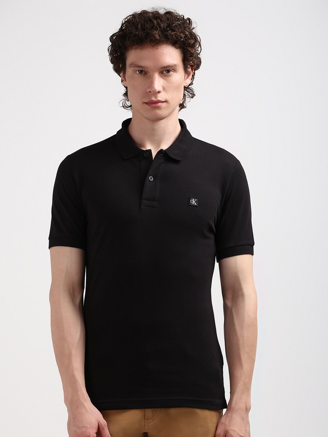 

Calvin Klein Jeans Men Polo Collar Applique Slim Fit T-shirt, Black