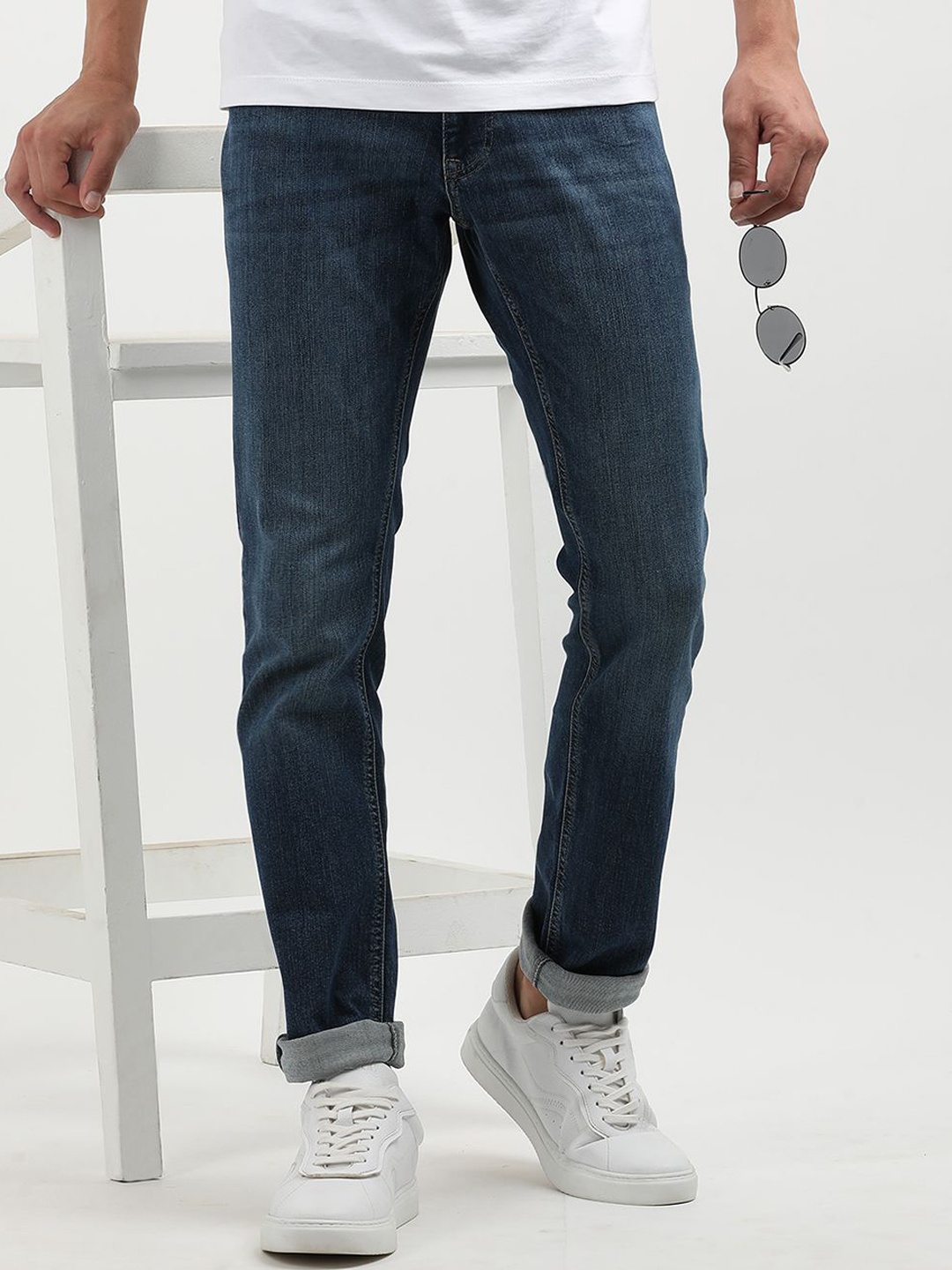 

Tommy Hilfiger Men Mid-Rise Slim Fit Jeans, Blue