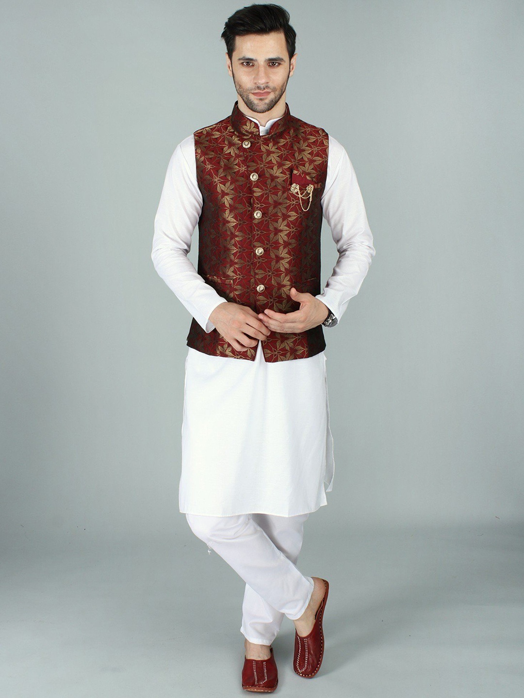 

Exotic India Rhubarb Asymmetric Jacquard Silk Modi Jacket Waist Coat with Mukaish Work, Red