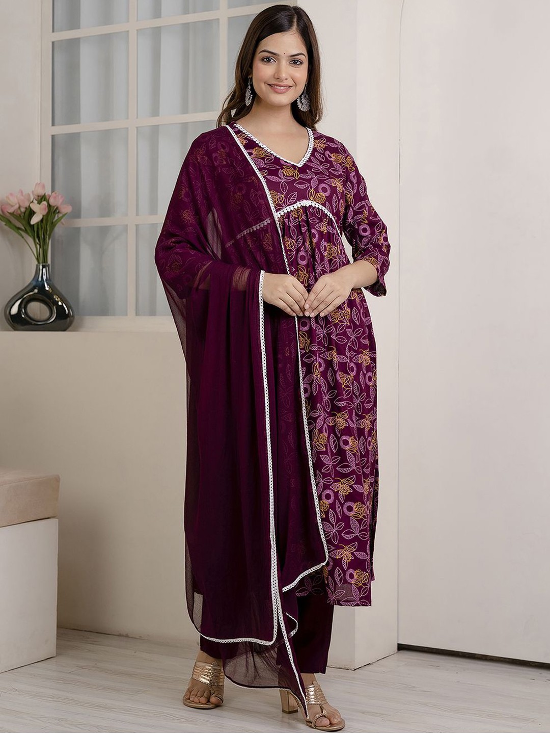 

Veshviti Women Floral Printed Pleated Liva Kurta with Trousers & With Dupatta, Maroon
