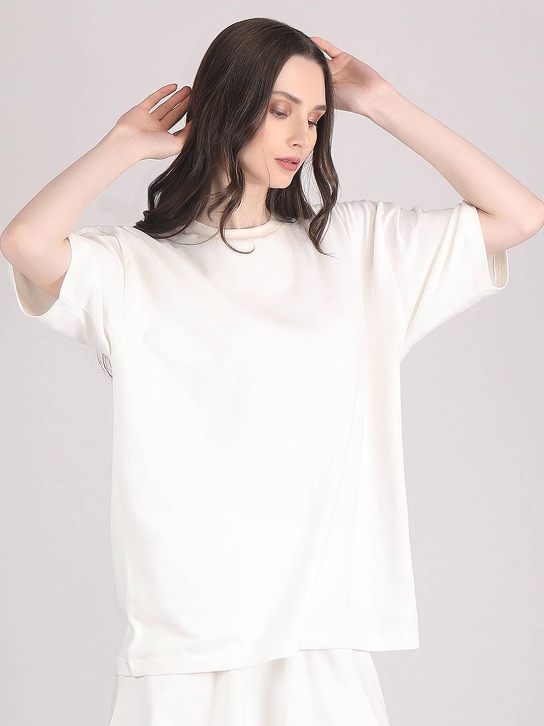 

Raxedo Women Solid Oversized T-shirt, Off white