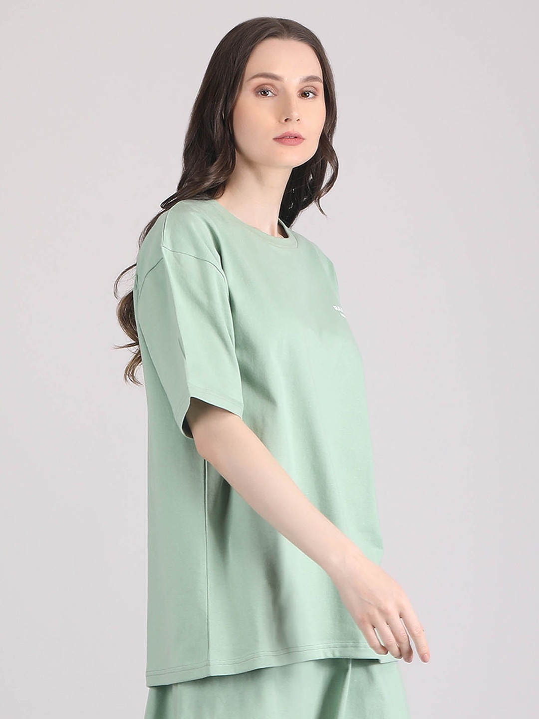 

Raxedo Women Solid Typography Brand Logo Oversized T-shirt, Green
