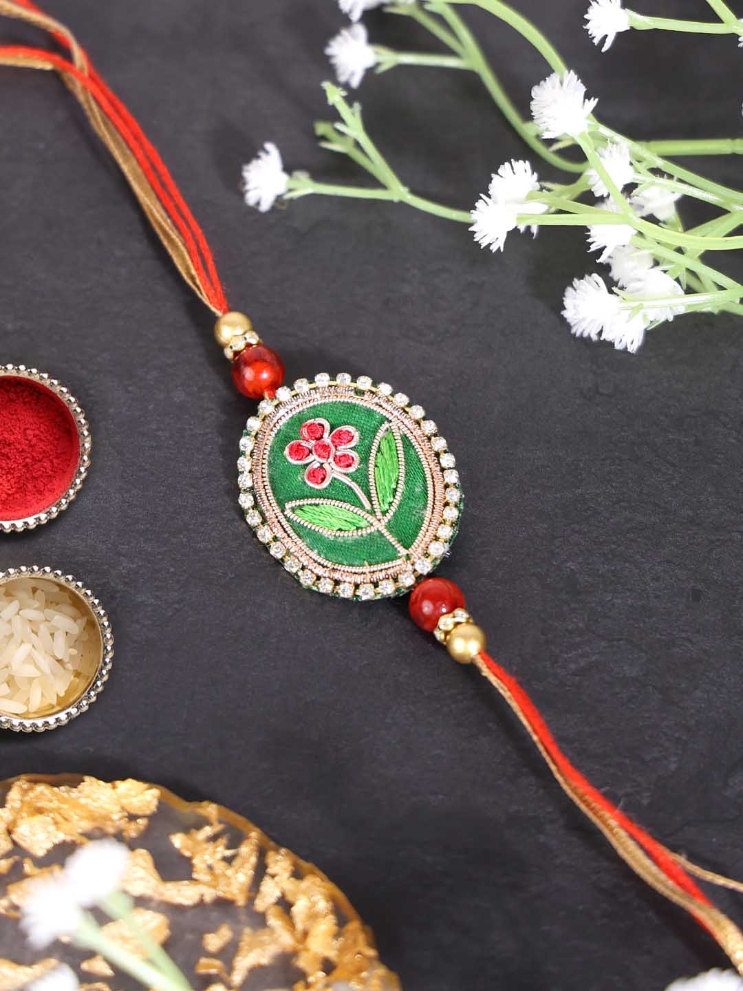 

PANASH- Men Gold Plated Beaded Floral Shaped Thread Rakhi With Roli Chawal