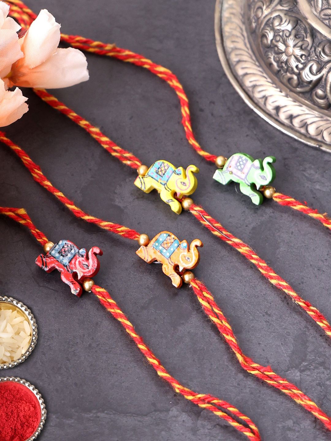 

PANASH Set Of 4 Unisex Gold-Plated Elephant Shaped Thread Rakhis With Roli Chawal