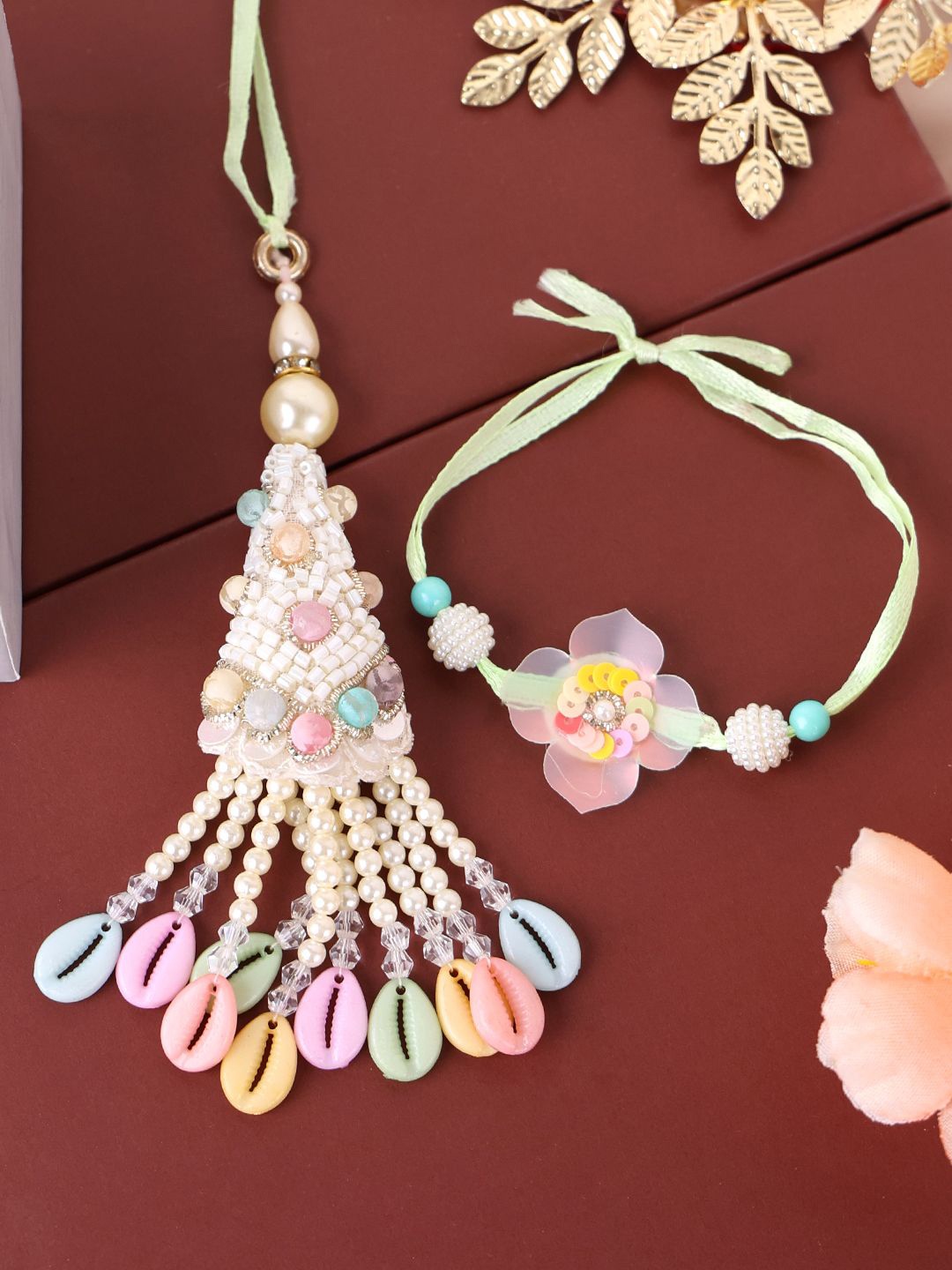 

PANASH- Gold Plated Beaded Floral Shaped Bhaiya Bhabhi Rakhis With Roli Chawal