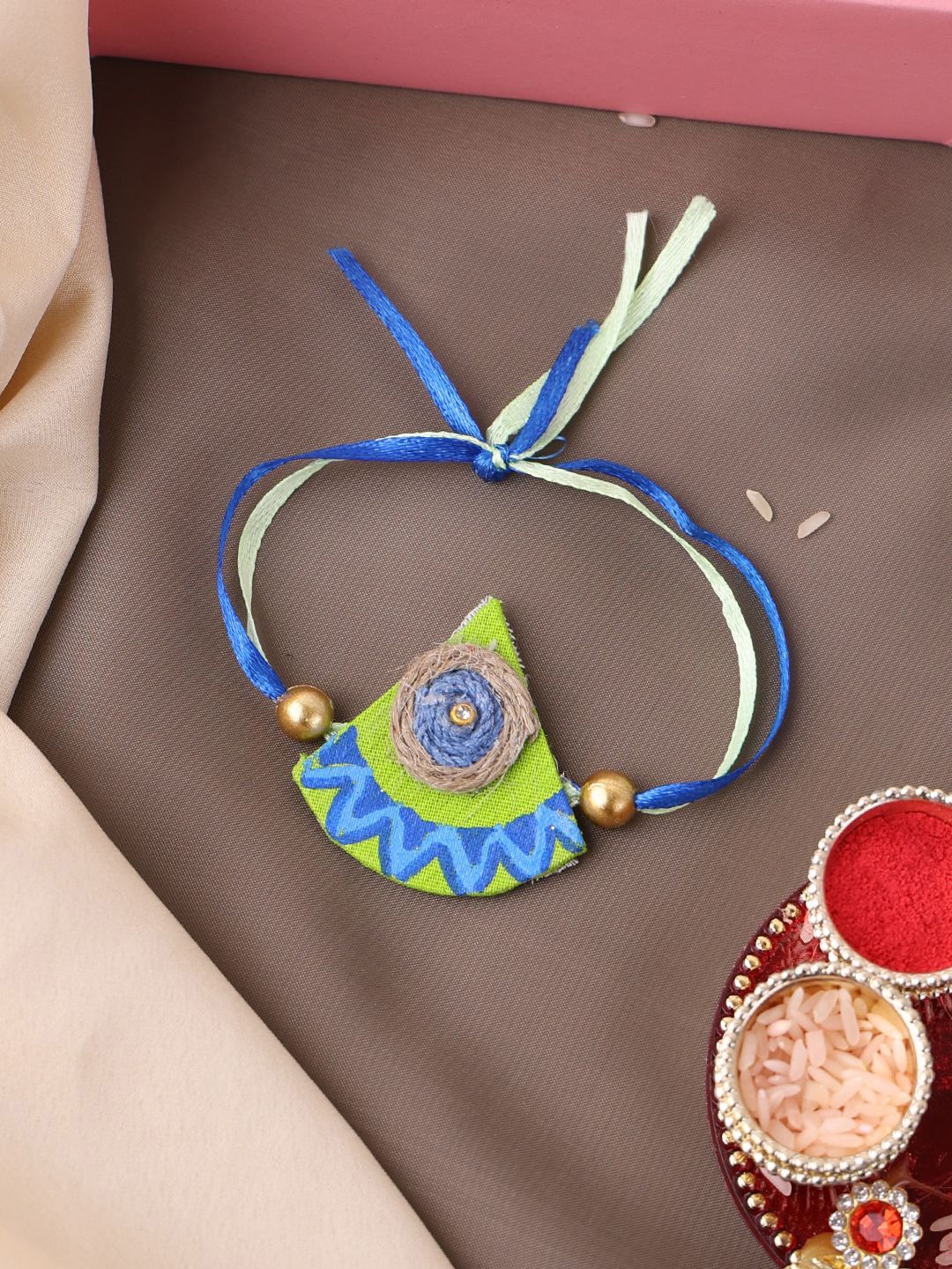

PANASH- Gold Plated Beaded Thread Rakhi With Roli Chawal